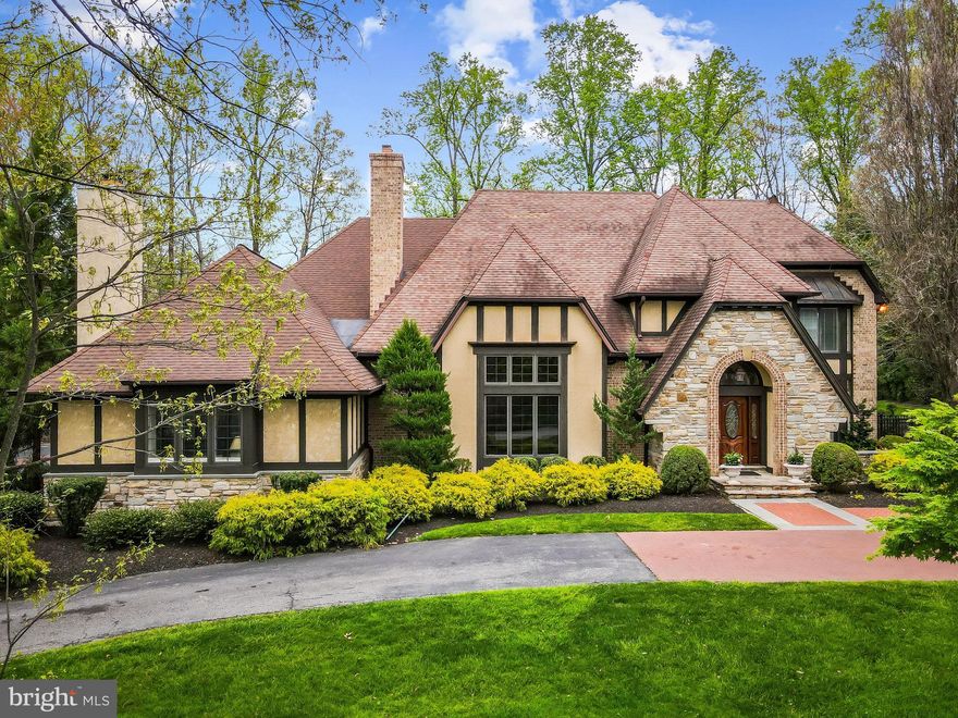 Establish roots in the Laurelford neighborhood. 13023 Jerome Jay Drive presents a four-bedroom and five-full bath Tudor-style retreat with a storybook curb appeal that will captivate your imagination.  This solid, custom-built home by Towles is a masterpiece of timeless elegance and an opportunity to add a contemporary flair. As you step through the grand two-story entryway with a marble floor and wrought-iron spindle staircase, you'll be greeted by the Tudor characteristics that define this home—accented dark wood details such as ceiling beams and embellished doorways; groups of windows filling the space with natural light; and a flexible, well-positioned floor plan perfect for both everyday living and entertaining. The main level features a great room with a cathedral wood-beamed ceiling and a stunning two-story stone fireplace.. The gourmet kitchen is complemented by a spacious eat-in area with a dome ceiling and window surround that seamlessly connects you to the outdoor living area. For more formal occasions, the two-story dining room offers an elegant setting. The entry-level primary bedroom suite is a private oasis with wood floors, a French door leading to a private bluestone patio, and a large walk-in closet with a built-in closet system. Loaf in luxury in the private bath featuring dual vanity sinks, a spa tub, and a spacious steam shower with custom glass doors, bench seating, and tile surround. Upstairs, two additional bedrooms await- a bedroom with an ensuite bath and walk-in closet, and another with direct access to the hall bath.  The bonus room was added in 2022 with a separate dressing area and walk-in closet. The lower level is perfect for guests or extended family, featuring an in-law suite with a side door and personal entryway, a large bedroom with vinyl floors, an ensuite bath with a walk-in shower, a kitchenette with a full-size refrigerator, a family room with a brick fireplace and built-in bookcases, an exercise room, and a hobby/craft room.  The home surround is a private paradise with a circular drive, a three-car garage with a workshop, abundant storage space, mature trees, and a spectacular patio for enjoying the serene surroundings. With its blend of Tudor charm and versatile living spaces, 13023 Jerome Jay Drive is more than just a home—it's a magical retreat. Schedule your private tour today and experience the allure of Laurelford living at its finest.