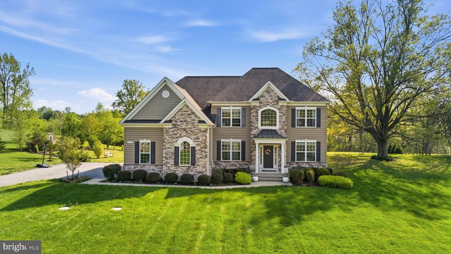 This stunning, nearly 6,400-square-foot residence is nestled in the premier community of The Lakes at Twin Shields, located in the northernmost part of Calvert County. Built in 2019 by Quality Built Homes, this exceptional property showcases all of today’s most sought-after features. The main level offers a gourmet kitchen complete with sleek stainless steel appliances, a center island, large pantry, pot filler, and farmhouse sink, perfect for both everyday living and entertaining. Enjoy the bright sunroom, an open-concept family room with a cozy gas fireplace, as well as formal living and dining rooms. A versatile main-level den, paired with a full bathroom, can easily be converted into a bedroom with the addition of a closet. Additional highlights include a convenient drop zone just off the garage and a beautiful blend of hardwood, ceramic, and luxury vinyl plank flooring throughout.  Upstairs, you’ll find three generously sized secondary bedrooms, a hall bathroom, and a spacious laundry room. The luxurious primary suite features a massive walk-in closet and a spa-inspired bathroom with dual vanities, a soaking tub, and a walk-in shower. The fully finished lower level expands your living space with a large recreation room featuring a wet bar, a fifth bedroom, a full bathroom, and a theater room, making it an ideal setup for extended guest stays. Exterior features include an oversized two-car garage, a paved driveway, and a deck perfect for outdoor relaxation or entertaining. Don’t miss this incredible opportunity to own in a highly desirable neighborhood within an award-winning school district, surrounded by other fine homes.