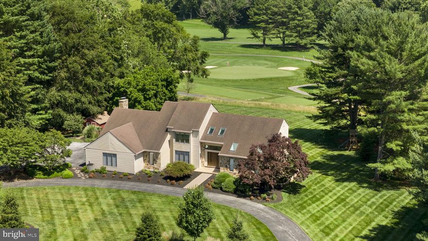 Welcome to 165 William Penn Boulevard, an exceptional home nestled on over 2 private acres with breathtaking views of holes 3 through 5 at Penn Oaks Golf Course. 
One of a select few homes directly neighboring the Penn Oaks Golf Club, this home offers a unique blend of panoramic course views with your own private oasis.

Step outside to an expansive deck overlooking a sparkling inground pool - a paradise for relaxation and entertainment. The lot is lined with mature trees, offering peace, quiet, and a sense of seclusion, all while enjoying golf course frontage.

Inside, the main level boasts a spacious primary suite with a renovated spa-like bathroom—featuring a tile shower with bench seat and double vanity. The updated kitchen includes quartz countertops, a tile backsplash, and a modern induction cooktop. Hardwood floors run throughout the living room, family room, and dining room, while vaulted ceilings and oversized windows flood the home with natural light and stunning views. 

Upstairs, you’ll find three generous bedrooms, a full bath, and a large loft area, perfect for a home office or playroom.

The walkout basement offers enormous storage potential and a flexible layout, ready to be finished to suit your lifestyle. A sliding door offers access to the pool area and backyard.

Additional features include a 3-car garage and a U-shaped driveway, providing plenty of parking for family and guests alike.

This is a rare opportunity to own a truly special home in one of the area's most desirable golf communities. Privacy, space, and luxury—right on the green.