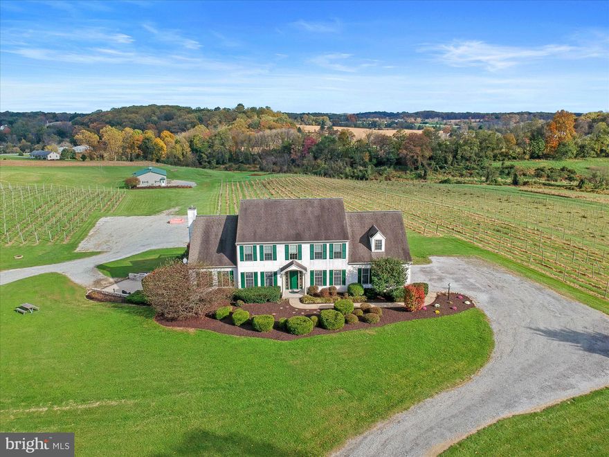 Opportunity of a lifestyle is calling! You just need to decide what your lifestyle and calling is. For the current owners, it was Kreutz Creek Vineyard and Event Venue, a hobby they started, in 1989, and grew into a 20 acre estate featuring 8 acres of grapevines used to produce award winning wines. Production included growing, bottling, labeling, corking, and capping by hand. Memories were made with weddings and concerts in the vineyard. The property is zoned for a Bed and Breakfast, and events up to 125 guests, three times a week. The owners are now ready to retire, but that doesn’t mean you can’t have a dream. This might just be the perfect time, to explore the possibilities presented with this estate. Maybe you also love wine and dream of growing your own grapes; maybe you love horses. There is a pretty sweet detached barn, with electric, water and three 10x10 overhead garage doors. Maybe you have hobbies with lots of toys; or maybe you just want to get away from it all.  No matter your dreams, they can be answered when you become the new owner of this 3600+ square foot residence, set on 20 of the most beautiful acres this side of heaven. The home features spacious rooms, cathedral ceiling family room, huge eat-in kitchen, 1st floor laundry room, primary suite with a 10x13 primary bath, and so much more. There is also an attached 3-car, end-load garage.  The lower level is partially finished as it used to host wine tastings. There are several rooms and lots of possibilities. A side entry door leads to a patio area overlooking the grounds. If you are nervous you might miss city life, great news, you are a short commute to Kennett Square, Chadds Ford, Longwood Gardens, and Philadelphia.  What are you waiting for!?! If you are one of the few who can afford it, you owe it to yourself to schedule a showing, of this once-in-a-lifetime opportunity.  AGENTS – Please read Agent Remarks!