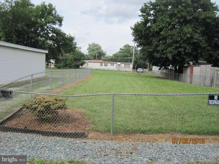 Lovely cleared 2 lots which is fully fenced, ready for your home! Large shed with two sides for storage, workshop, lots of shelving. Septic  & well in place (previous home had fire, absolutely no debris left, cleared & ready for another home). Could possibly divide the lots. Subdivision close to Jefferson & Berkeley counties, off old Rt 9 for easy access. Approx. 1/2 acre with 2 lots combined.