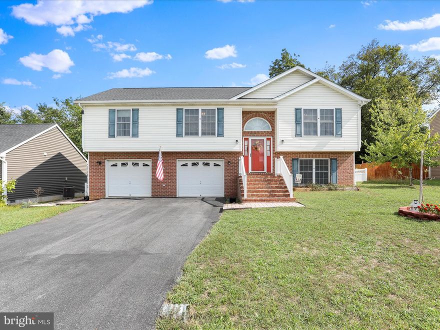 Welcome home to this 4 Bedroom, 3 Full Bathroom full of potential in Martinsburg, conveniently located close to shopping and restaurants! 103 Owl Ave is worth a look in person, with features not typical to a split-foyer home, like an oversized 2-car garage and split bedroom floorplan! Extra wide entry steps lead up to the front porch and into the foyer. The main living area is open and bright with vaulted ceilings giving it a spacious feel. The kitchen features a large peninsula countertop with bar seating, perfect for food preparation and hosting. The vaulted Primary Suite has a convenient layout with two large walk-in closets, and bathroom with double sink vanity, separate shower and soaking tub and toilet room with room for extra storage. On the other side of the house are the two main level, nicely-sized, secondary Bedrooms with large closets and a second full Bathroom that’s also available to guests. Downstairs you will find the large 4th Bedroom that could also serve as a family room/game room/guest suite with it’s own full Bathroom. The laundry room is also on the lower level, conveniently located right inside the garage entry. Out back, you’ll be able to enjoy the private, wooded view from the low-maintenance composite deck that has a retractable awning to provide shade in those summer days while looking over the fully-fenced backyard. Updates include a new HVAC in 2025, and refrigerator and washer/dryer are only a year old! Professional photos coming Sept 27th.