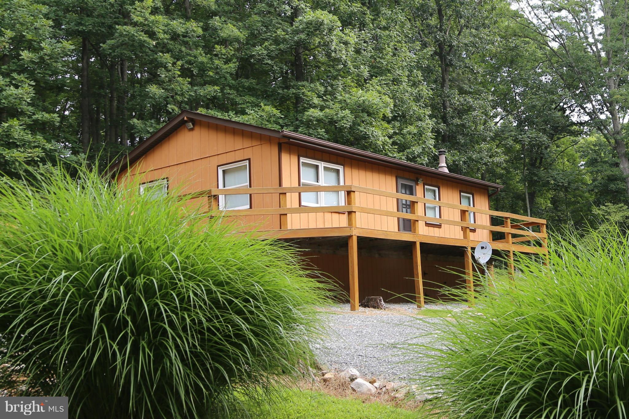 1BD/1BA cabin minutes from Trout Pond National Park and Lost River community hub. Perfect secluded property with wooded land and adjacent lot combining for 8.77 acres backing to GW Natl Forest for a nature lover, hunter, or rest & relaxation. Well maintained cabin with wood ceilings, wood walls, open floor plan. Additional unrestricted contiguous 6.14ac also available - HD8519357.