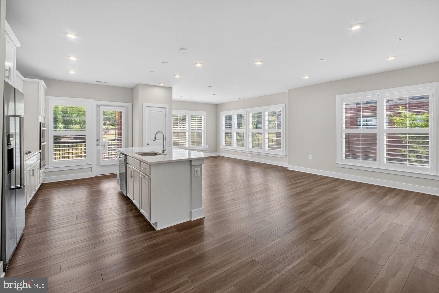 Step into modern elegance at this 2BR, 2BA & DEN corner-unit condo in the highly sought-after Flats at National Harbor. Built 2 years ago, this spacious 1,705 sq/ft. Allyson floor plan combines upscale finishes a low-maintenance lifestyle, just steps from dining, shopping, and the waterfront.
Inside, the open-concept living area is filled with natural light from expansive windows with Exus Shutters, while the chef’s kitchen impresses with quartz countertops, stainless steel appliances, gas cooktop, double ovens, and a large island are perfect for entertaining.
The primary suite is a serene retreat featuring a walk-in closet and spa-style bathroom with dual vanities, a frameless glass shower, and elegant tile finishes. A spacious second bedroom and full bath provide comfort for guests, while the private covered balcony creates the ideal spot to unwind outdoors. With an Additional Den for guests or an office, nursery or quiet spot.
Additional highlights include a full-size laundry room with washer and dryer, 2-car tandem garage parking, EV Charger, secure entry, and energy-efficient systems including a Lennox HVAC and tankless water heater.
Located in the vibrant National Harbor Waterfront District, this home places you within walking distance of award-winning restaurants, boutique shopping, MGM Casino, Tanger Outlets, and scenic waterfront trails. With quick access to Washington, D.C., Alexandria, and Northern Virginia, this condo offers the perfect blend of luxury, convenience, and connectivity.