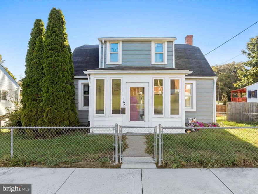 Come and see this downtown charmer of a home! The home boasts plenty of main level living with a main level bedroom, living room, dining room and kitchen! The kitchen offers plenty of storage with the numerous cabinets.  There are wood floors that run throughout the home. The enclosed back porch area is ideal for a kids play area or an office. The enclosed front porch is great for dropping dirty shoes and bags or simply relaxing.  The location of the home is on the edge of town with a nice view of Mill Creek Mountain and within walking distance of the shops on Main Street and other amenities. You can enjoy the mountain view from a back deck that overlooks the fenced-in backyard. Come and check out this downtown Charming Cape Cod!