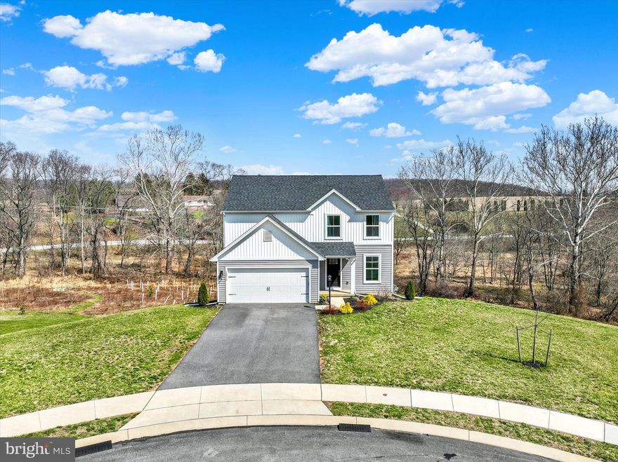 Set on nearly 9 acres, this 2024-built home is your private retreat—tucked away on a quiet cul-de-sac with no future building behind you. It offers the perfect blend of tranquility and neighborhood charm, combining privacy, space, and modern comfort in a highly desirable location near I-83 and the PA/MD border.
Step inside to an open-concept home filled with natural light. The gorgeous kitchen features a large island, dining area, and seamless flow into the family room—ideal for gatherings, entertaining, or relaxing. A versatile main-level flex room works beautifully as a home office, playroom, or quiet retreat. Upstairs, you’ll find four generous bedrooms, including a luxury primary suite with a walk-in closet and private bath. Second-floor laundry adds convenience to daily living. The unfinished basement offers unlimited potential! Create your dream home theater, guest suite, or gym, complete with the included gym equipment($6500 value!) and a nearly new hot tub ($9,000 value!) to overlook your private oasis. The two-car garage is EV charger-ready, and the property delivers serene views, local wildlife, and the peace of nature—all just minutes from shopping, dining, and commuter routes. Schedule your private tour today and see it for yourself!