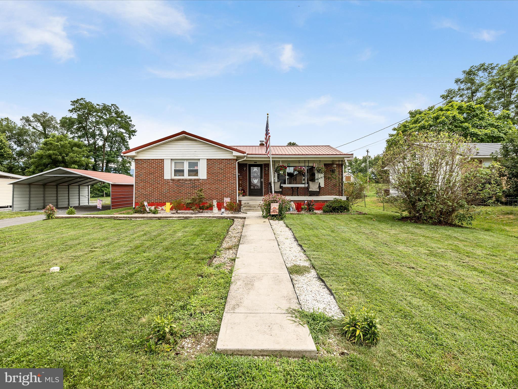 Welcome to this spacious 5-bedroom, 2.5-bath brick rancher located in the heart of Moorefield. Situated on a 0.46-acre lot, this well-maintained home features a newer metal roof, updated windows, and over 2,800 sq ft of finished living space, including a fully finished basement. The main level offers two bedrooms and one full bath, one half bath, while the lower level includes three additional bedrooms, a full bathroom, and versatile living or recreation space. Outside, enjoy a fenced backyard with a storage shed, a detached one-car garage, and additional parking for multiple vehicles. Conveniently connected to public utilities with access to high-speed fiber-optic internet. Just minutes from schools, shopping, and town amenities—this home offers space, functionality, and value in a desirable location.