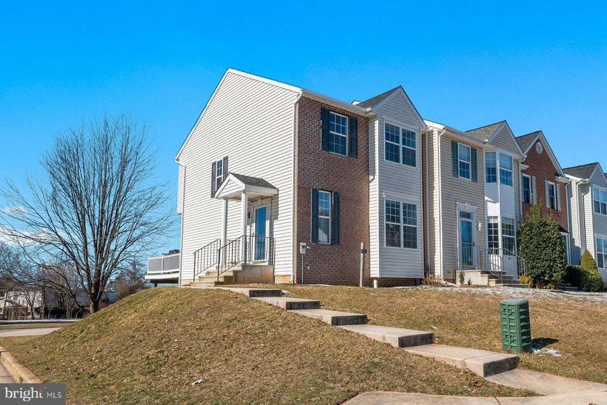 OPEN HOUSE THIS SATURDAY, 11-1! Move right into this updated brick front end-of-group townhome! Recently painted throughout, this one is ready for quick move-in. Kitchen got refreshed with painted cabinets, SS appliances and new tile backsplash. Roof is one-year-young! Walk right out from kitchen to the roomy composite deck. Fresh new carpet on upper level and entire house professionally cleaned for new owners, including all hard surface flooring. With its larger lot, this unit has a two-car private parking pad. Main level has hardwood floors and lots of light beaming into the family room. On the upper level you'll find all three bedrooms two full baths. The lower-level is fully finished with its own half bath, and slider that walks out to the backyard. Book your showing today!