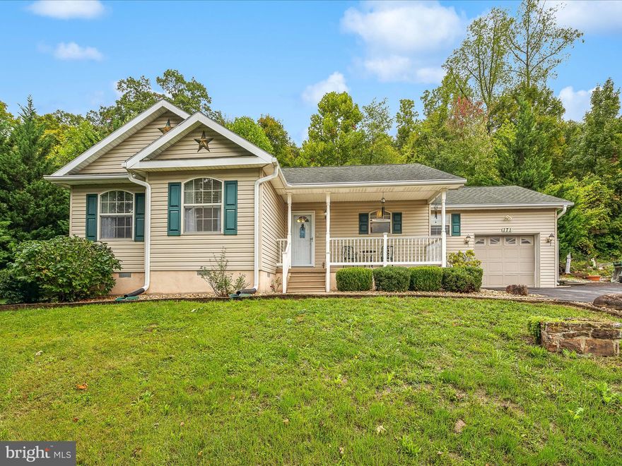 This well-maintained ranch style home offers everything you need on a single level! The open concept living room, dining room, and kitchen features vaulted ceilings and a mixture of laminate and vinyl plank flooring. The kitchen is complete with beautiful granite countertops and tile backsplash. Through the living room you will find a spacious sunroom that leads to the back deck. Conveniently placed between the kitchen and the attached one car garage is the laundry/mud room. The primary bedroom offers an attached bath with a large walk-in shower as well as a large walk-in closet. This home also features an additional two bedrooms and one bathroom. All of this AND the location being just minutes from downtown Berkeley Springs where you will find a variety of local shops, restaurants, and spas for you to enjoy makes this home a must see!