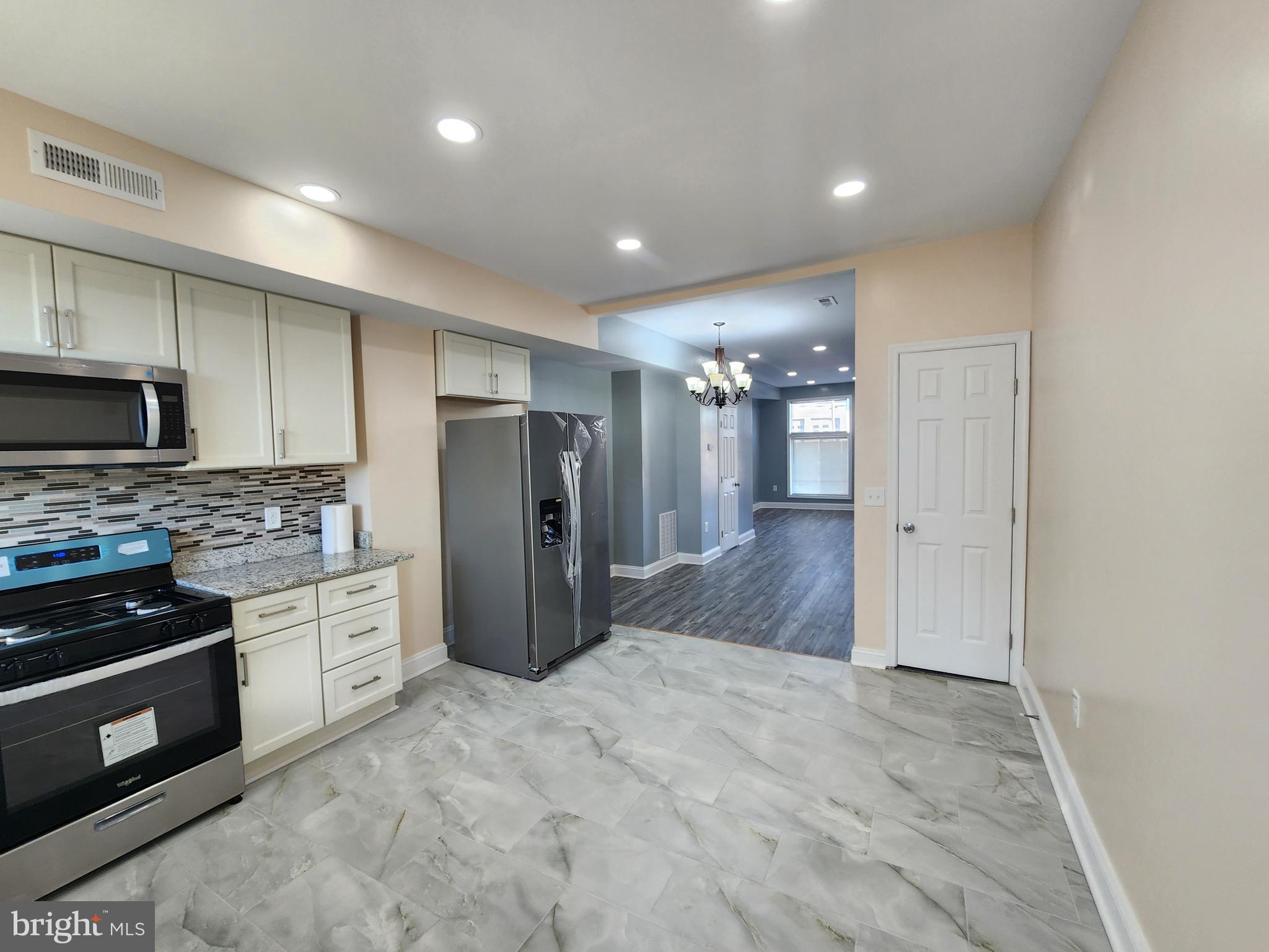 Easily one of the best rehabs in the Johns Hopkins area. This light filled modern home has new appliances, new floors , windows and on and on.  The contemporary floor plan will impress with a good sized bathroom on each level large open basement and quaint rear yard. FHA READY.  Ground rent unknown.