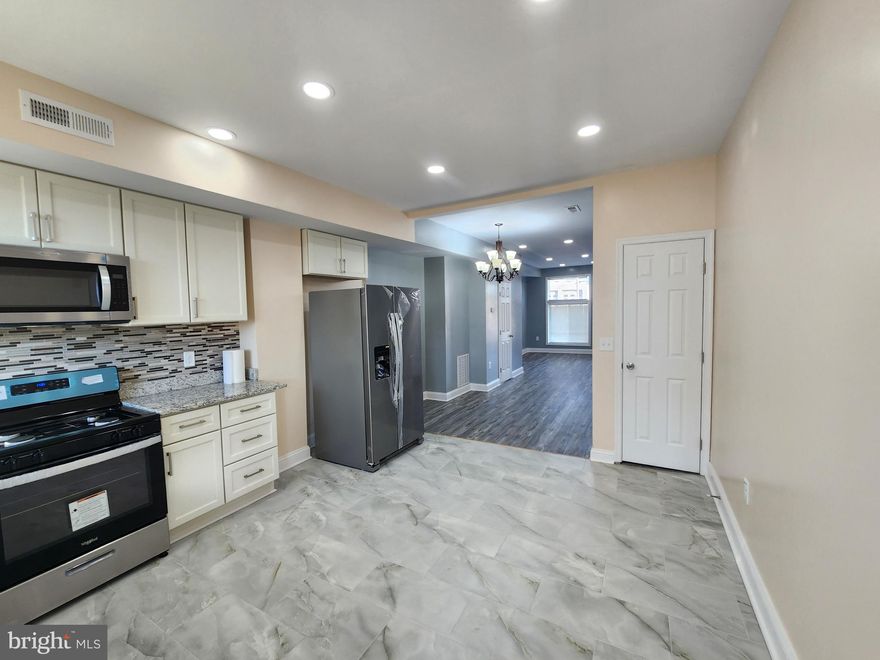 Easily one of the best rehabs in the Johns Hopkins area. This light filled modern home has new appliances, new floors , windows and on and on.  The contemporary floor plan will impress with a good sized bathroom on each level large open basement and quaint rear yard. FHA READY.  Ground rent unknown.