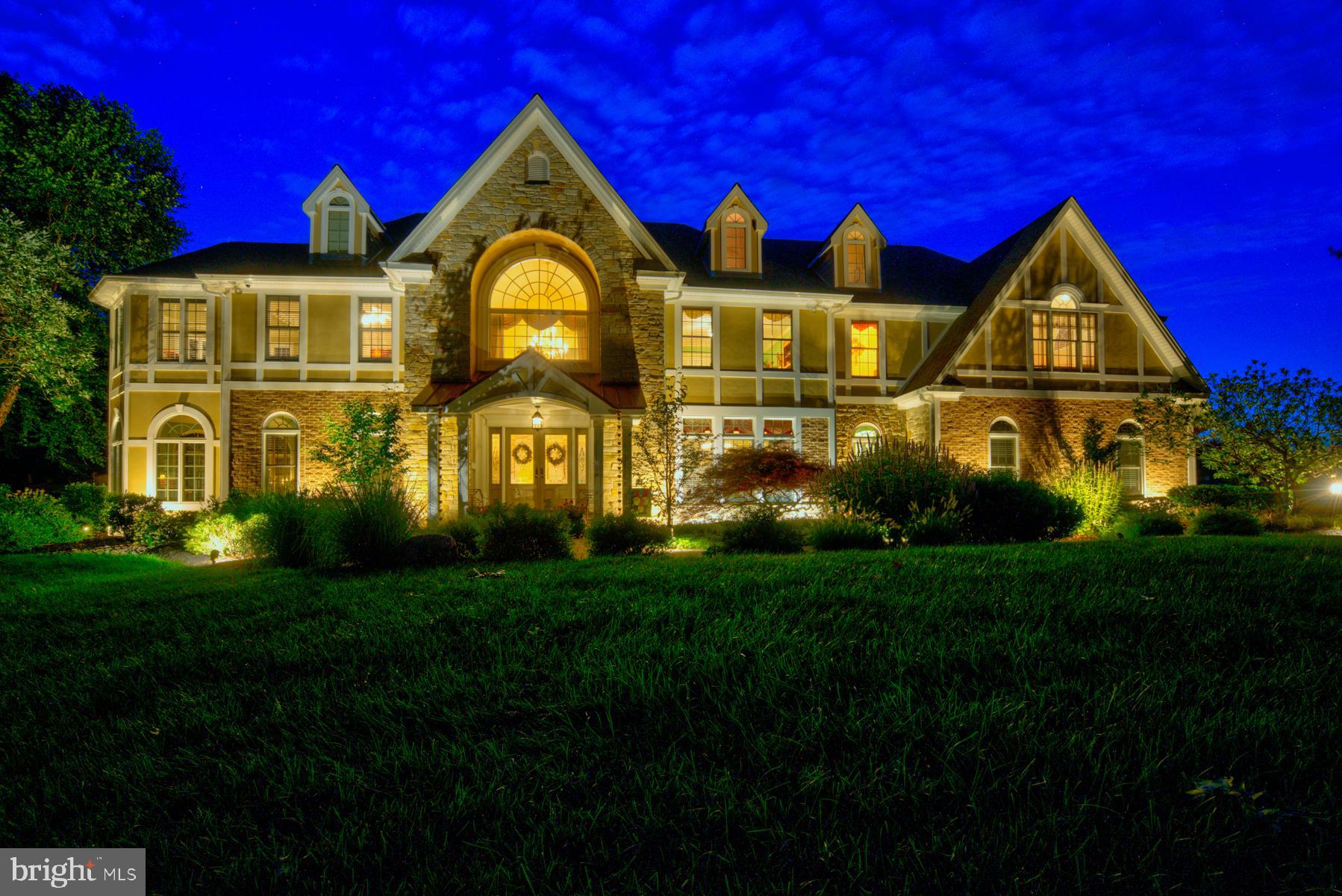 An Exceptionally unique home with a fabulous in ground pool  is located on one of Lower Gwynedd's most prestigious roads. The 4/5 bedroom property sits on professionally landscaped grounds with mature trees, plantings and meticulously kept flower beds that possess an array of color and texture for you to enjoy. Stroll up the paved walkway to the stunning double doors with glass sidelights. No need to worry about the rain, as it is a covered entrance. As you walk thru the home you will appreciate that the original owner was a builder as every detail was thought through with the best materials being used to construct the home. Be greeted by a soaring two story foyer with a grand chandelier, marble floors, a stunning curved staircase and an open floor plan flood lit with sunshine from the extensive windows. Throughout the home you will see the attention to detail with custom designed millwork, moldings, alcoves, columns, and beautiful built in shelving to display your precious belongings. There is a large living room with a wall of windows, a picture-perfect fireplace and plenty of room to enjoy the tranquility of the home. The open concept dining area is complete with a trey ceiling, stately columns and large windows allowing sunlight to flow thru the home. A 2-story family room is framed with expansive windows overlooking the backyard oasis. Off to the left is a tranquil room that lends itself to a study/office with a beautiful fireplace, a drinks refrigerator, custom woodwork and a view of the serene back yard. The gourmet kitchen is comprised of the very best stainless-steel appliances, a wealth of custom cabinets with under cabinet lighting, great counter space for preparing meals, a large island that provides a great space for eating casually.  If that's not enough the kitchen opens to an additional family room with an abundance of character and charm. A nicely sized laundry/mudroom and half-bath complete the first floor. Upstairs you will be surprised to find two owners suites, 4 bathrooms and a bonus room on the third floor which could easily be utilized as a 5th bedroom. The first Owners suite is very spacious, offering a beautiful sitting area. The expansive luxurious bathroom offers separate vanity areas, large counter space, a spacious tiled shower with built in seating, a deep soaking tub and large windows that keep the sun light pouring thru the room. A custom fitted walk-in closet completes the suite. The additional owner's suite has a custom fitted closet, a window seat under the large Palladian window and a nicely appointed bathroom. The additional two bedrooms also have bathrooms and plenty of closet space. If that isn't enough there's an incredible finished basement that comprises of a gym, a full bathroom, a fireplace and so much space you can accommodate a pool table, ping pong table, full sized couch and still have a wealth of room left. There is a nicely sized work / storage area. The beautiful secluded backyard is enhanced with a stunning gunite heated in-ground pool and spa tub.  No need to miss the fun this year ! The expansive blue stone paver patio includes a top of the line outdoor TWIN EAGLE kitchen for that ultimate barbeque experience. Outside music is also available thru the sound system. An immaculate finished 3 car garage completes the home. The home also includes a generator, water softener, radon remediation system,  Sonos sound system, custom window treatments, 4 zones for complete temperature control of the home, flood lighting, security system and a new roof.   The care and attention to detail makes this home shine and will allow the new owner to just move in. Located in Lower Gwynedd, close to major roads, shops, restaurants, Whole foods, Starbucks, train stations for easy access to Philadelphia. Sought after Wissahickon School District and close to Gwynedd Mercy and Germantown Academy. Give yourself the house you deserve, book your appointment today.