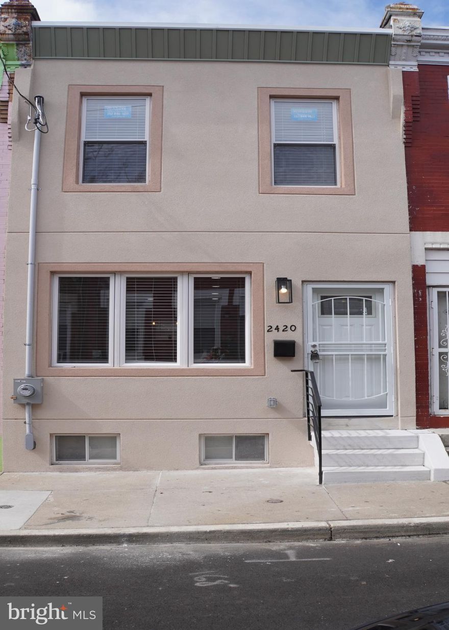Back on the market. Mortgage fell through. Huge price discount. Beautiful two bedroom house in a upgrowing area of North Philly. Completely redone from top to bottom with new floors, walls, bathrooms, bedrooms, kitchen, roof, plumbing, electric, sewer and high quality material and  workmanship. Conveniently located couple blocks from Temple University and walking distance from Broad St line subway. First time homebuyer's program available with $15,000 closing cost assist for qualified buyers, call for details. Do not miss this one.