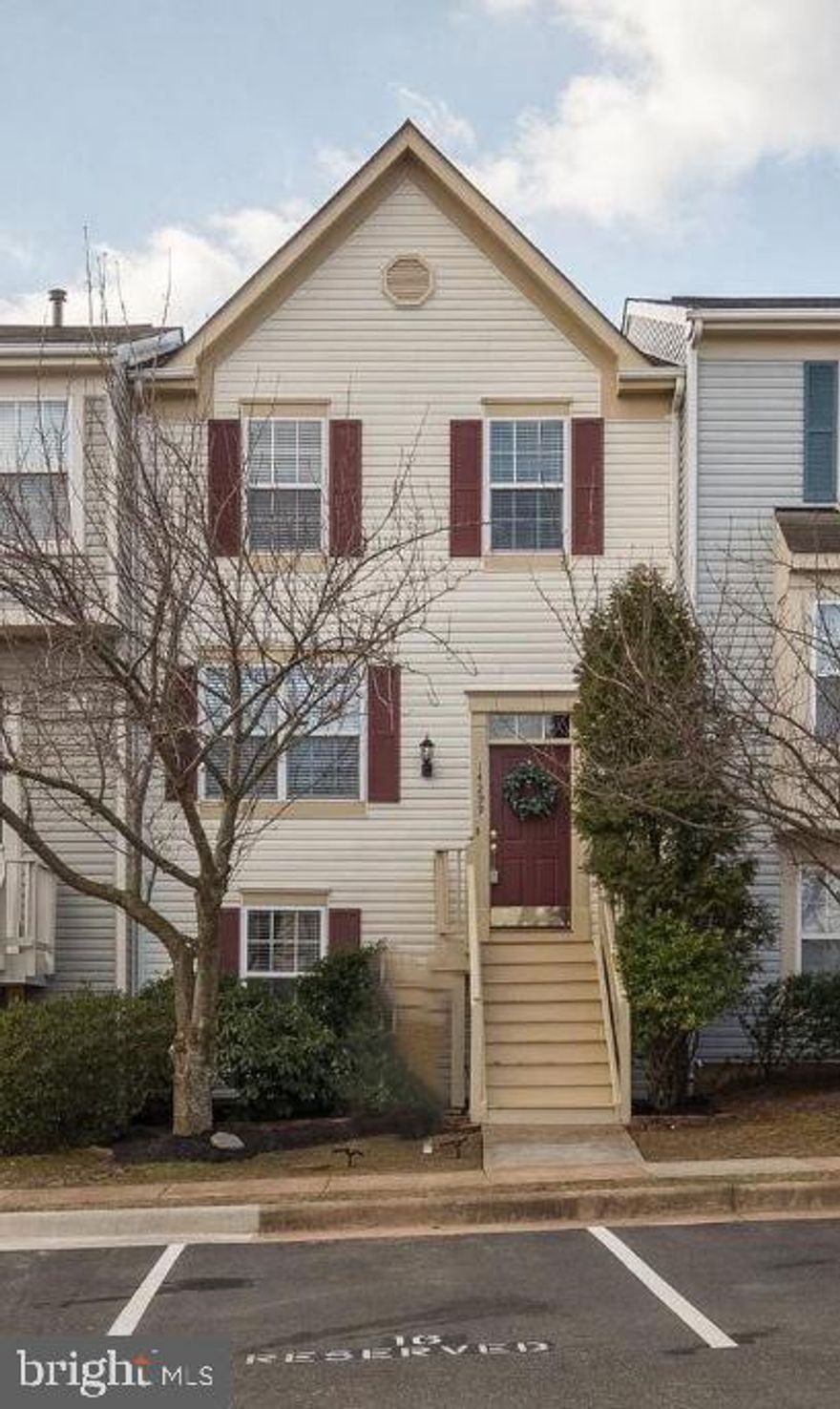 Nestled in the heart of Crossroads Village, this expansive 2,000 finished square foot, 4-bedroom townhouse seamlessly combines modern living with comfort. The upper level boasts 3 bedrooms and 2 full bathrooms, while the main level features an open-concept design, a convenient half bath, and access to a spacious outdoor deck. The versatile lower level includes a fourth bedroom, a full bathroom, and a recreation room—ideal for unwinding or hosting guests. The home showcases elegant hardwood floors throughout the living room, reading room, and sitting area. The kitchen has been tastefully renovated with polished granite countertops, stainless steel appliances, and a built-in microwave, making cooking a pleasure. The outdoor spaces elevate the property's charm, offering a large deck for gatherings and a private, fenced-in patio for added privacy. Dedicated parking ensures convenience, while the community amenities—such as a pool, clubhouse, playground, walking trails, and more—enhance the lifestyle. Situated in a prime location, the home provides easy access to Route 66 and Route 29, placing shopping centers and local attractions just moments away. Available Now.