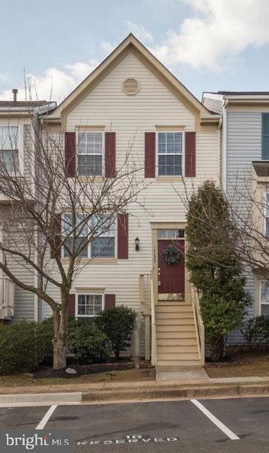 Nestled in the heart of Crossroads Village, this expansive 2,000 finished square foot, 4-bedroom townhouse seamlessly combines modern living with comfort. The upper level boasts 3 bedrooms and 2 full bathrooms, while the main level features an open-concept design, a convenient half bath, and access to a spacious outdoor deck. The versatile lower level includes a fourth bedroom, a full bathroom, and a recreation room—ideal for unwinding or hosting guests. The home showcases elegant hardwood floors throughout the living room, reading room, and sitting area. The kitchen has been tastefully renovated with polished granite countertops, stainless steel appliances, and a built-in microwave, making cooking a pleasure. The outdoor spaces elevate the property's charm, offering a large deck for gatherings and a private, fenced-in patio for added privacy. Dedicated parking ensures convenience, while the community amenities—such as a pool, clubhouse, playground, walking trails, and more—enhance the lifestyle. Situated in a prime location, the home provides easy access to Route 66 and Route 29, placing shopping centers and local attractions just moments away. Available Now.