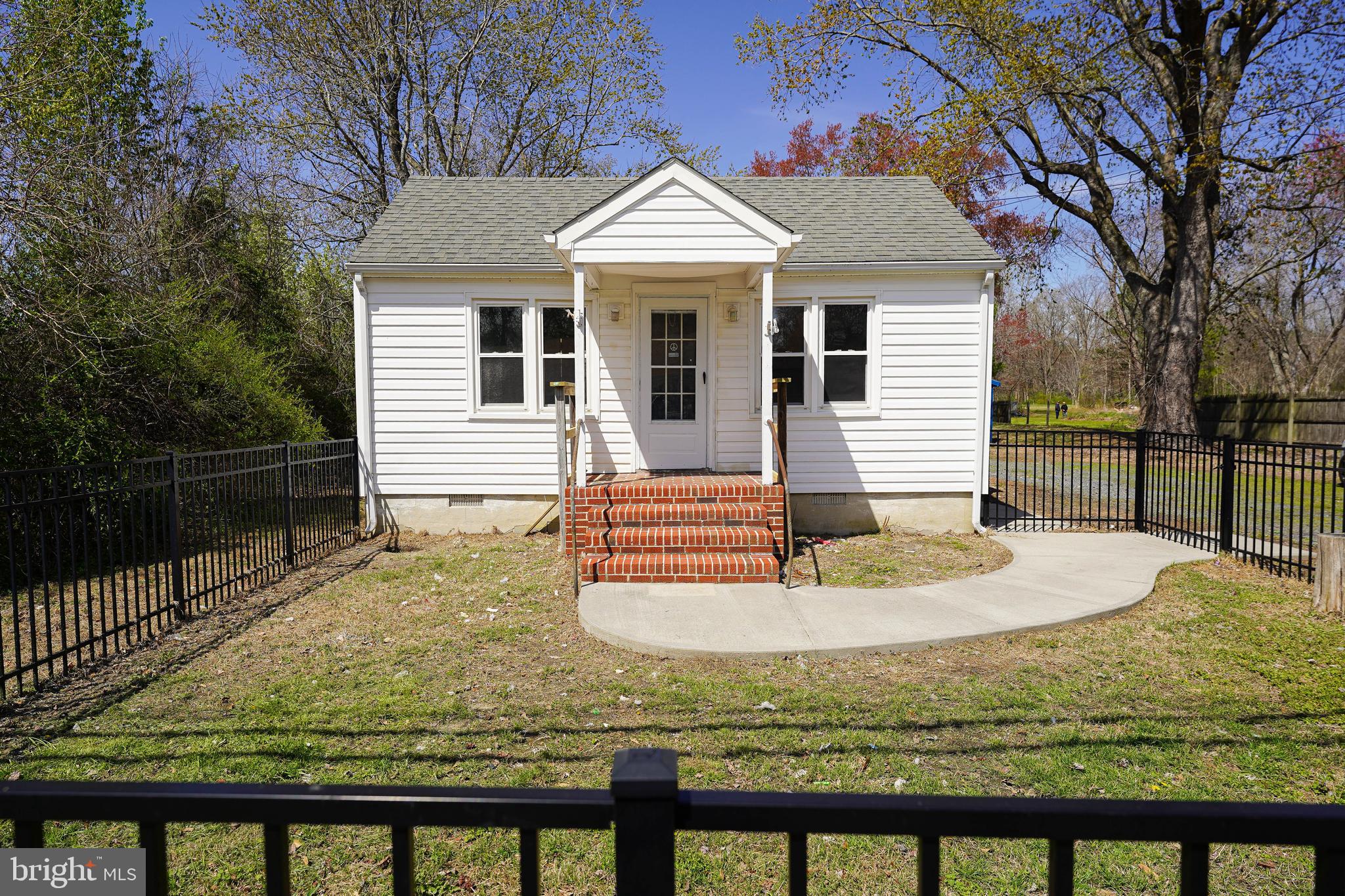 *** SELLER FINANCING AVAILABLE WITH ACCEPTABLE TERMS *** Adorable and affordable 2BR/1BA cottage w/detached garage on a nice-sized lot. Many updates and improvements - new flooring and paint throughout, new mini-split unit for heat and air conditioning. Replacement vinyl windows. Septic was updated in 2019, and just inspected in January 2025. Fully-fenced area in the front yard; partially fenced rear and side yards. Cute eat-in kitchen w/new paint, new stove, new LVP flooring opens into the cozy living room w/new paint and new carpet. 2 bedrooms - new carpet, new paint. Full bath w/tub/shower combo, new LVP flooring. Great location - quick trip to shopping, dining, events, but with a country feel - 10 minutes West to Downtown Salisbury - 20 minutes to Berlin aka "America's Coolest Small Town" - 30 minutes to Ocean City! Owners are licensed realtors in the states of Maryland and Delaware; listing agent has financial interest. Sizes, taxes approximate