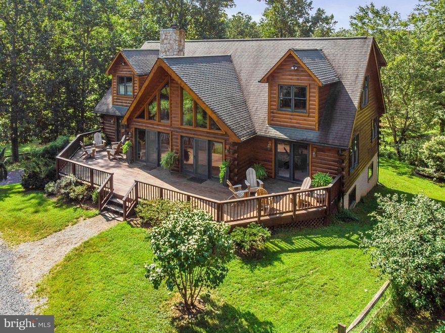 Amazing contemporary log home in private setting on 11 acres just 12 minutes to Warrenton with 3 barns and 10 paddocks! Huge rooms, custom cabinets w/granite countertops, new appliances, open floor plan flooded with light, great room w/fireplace, all bedrooms have private baths, custom blinds, rec room in basement plus storage, deck for grilling, generator, gardens, stocked pond. NO HOA!