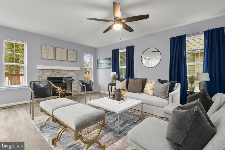 Welcome to this exquisite Craftsman-inspired new build home, a testament to superior quality and contemporary elegance. This 3-bedroom, 3.5-bath residence beckons with its charming facade and modern interior touches. Step onto the inviting front porch, a perfect spot for relaxation while savoring your favorite beverage. Inside, the open and spacious layout features a fresh, neutral color palette and luxury vinyl plank flooring providing a versatile backdrop for various living arrangements. The main level is a focal point of comfort, with an expansive living room, dining area, and family room complemented by a cozy stone-front gas fireplace.  Culinary enthusiasts will revel in the gourmet kitchen, complete with stainless steel appliances, a well-lit kitchen island adorned with modern pendant lighting, and sleek white cabinetry complemented by a ceramic tile backsplash. Retreat to the primary bedroom suite for restorative slumbers, offering a walk-in closet and a spa-like en-suite bath with a soaking tub. Two additional bedrooms and a full bath complete the tranquil sleeping quarters.  The fully finished walk-out lower level presents endless possibilities, allowing you to customize additional rooms such as a recreation room,4th bedroom, an office, or a game room. A full bath enhances the flexibility of this lower level. Outside, the property is a haven with a paved driveway for extra off-street parking, a fully fenced backyard for privacy, and a sizable wood deck off the kitchen—an ideal space for outdoor gatherings. Experience the perfect blend of craftsmanship and modern living in this stunning home.  Conveniently located near major commuter routes including I-695, I-95, and I-83 for easy access to many destinations.  Note: One Interior Photo is Virtually Staged