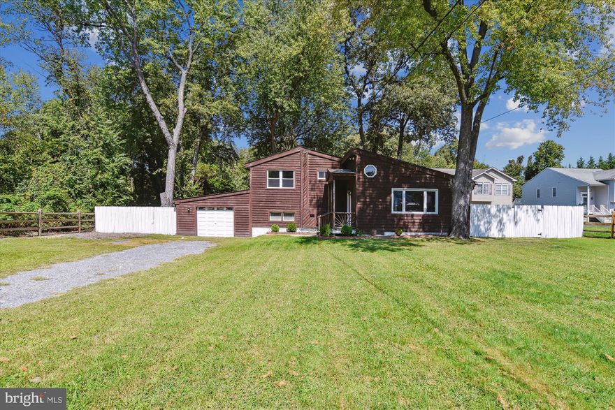 VA Assumable loan under 3% for qualified VA buyer with quick settlement possible.  Welcome to your dream home nestled in the perfect blend of country tranquility and suburban convenience! This updated split level offers the best of both worlds - modern comfort and easy access to commuter routes.  A spacious 3 bedroom and 2 bath home with plenty of room for family and guests. You'll love the open concept with natural light pouring in through large windows, skylights, and doors. The updated kitchen with island is perfect for both casual family meals and gourmet entertaining. NEW double oven and microwave.  Multiple decks overlook a beautifully landscaped backyard to relax and entertain. Additional living space in the lower-level and bonus detached studio. The fenced yard provides privacy and a secure space for outdoor activities, making it ideal for people of all ages, children or pets. Don’t miss this opportunity to own a beautiful home in a prime location.  Recent updates include NEW roof and insulation,  NEW fence, and extensive exterior improvements. HVAC & Water Heater approx. 5 years old.  NEW entry door, newer windows and rear slider doors.  You'll love it!