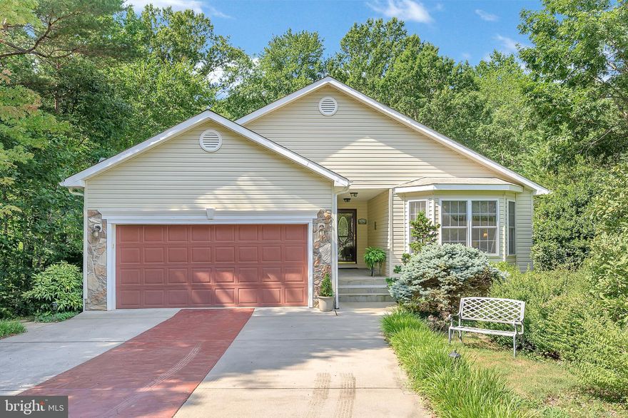 Welcome to 312 Battlefield Road! This beautiful custom-built home, nestled in the trees, and move in ready will delight from the moment you drive up.  Once you enter, you are welcomed by gleaming hardwood floors, a great room with gas fireplace, fine finishes throughout, and a sought-after open floor plan!   The kitchen  has upgraded appliances, pantry and a large island!  You will love the master suite that is so inviting and spacious.   The en-suite master bath has a double vanity and a gorgeous tiled shower with jets.  Two more spacious bedrooms, full bath and laundry room complete the main level.   Enjoy sitting on the screened porch with your favorite beverage off the master suite.  The lower level features a family room with gas fireplace, a 4th bedroom and half bath.  That is not all.... off the lower level patio is a separate room that can be used as a garden potting room and also a workshop and storage.  Imagine sitting on your deck listening to all the sounds of nature, entertaining family and friends or just relaxing.   A whole house generator conveys with automatic transfer.   A private, gated, secured community, Lake of the Woods offers anything and everything you could possibly want. Home to two lakes (the 550 acre main lake and a 35 acre "fishing lake"), a golf course, an equestrian center, a fire and rescue department, and a church all within the gates, Lake of the Woods simply has it all. Whether your passion is boating, water skiing, kayaking, golfing, horseback riding, or simply taking in the breathtaking views from the clubhouse while enjoying a fabulous meal, from your own deck or yard, or from one of the beaches, you won't be disappointed! Perhaps you'd like a game of bridge or volunteering your time and talents...Lake of the Woods offers more than 60 clubs and/or organizations from which you may choose to become involved. Located in Orange County, we are fortunate to enjoy low real estate taxes. Coupled with home prices ranging from $150,000+ to over $2,000,000, Lake of the Woods is the perfect community for both full-time residents, as well as weekenders. But don't take my word for it, please come see for yourself! I will gladly give you a tour of Lake of the Woods by boat and by car so that you may experience why I love Lake of the Woods!