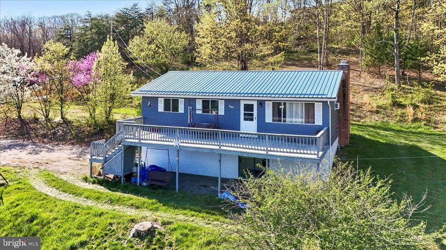 Welcome to the charming and scenic beauty of Wild and Wonderful West Virginia and low property taxes. This property offers exceptional potential and won't be available for long! With some minor updates, this 3-bedroom, 2-bathroom home, set on 2.36 acres, could be the perfect place to call your own. The finished family room features a cozy stone wood-burning fireplace and provides convenient entry to your expansive land with  mountain views. The home also boasts a spacious, well-appointed kitchen, as well as both attached and detached garages. Metal roof under 10 years old. Kitchen and laundry appliances convey.  
  Don't miss out on this opportunity!
