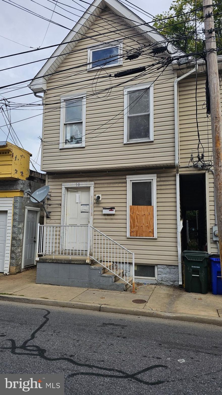 Investor opportunity! Property is in need of rehab. Main level features a living room, kitchen and a rear enclosed room for laundry area.  Two bedrooms on upper level with a full bathroom.  Fenced yard. Close to many amenities.