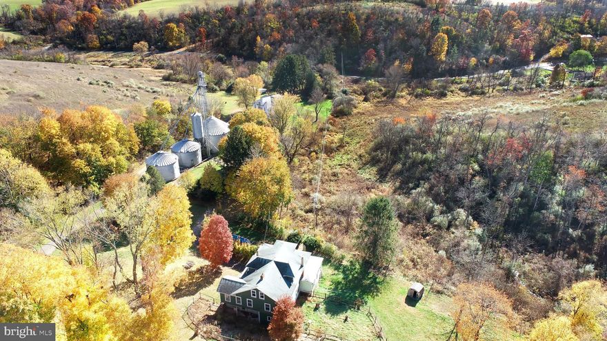 Approx. 317 acres,  3 parcels sold as one - 2 good solid homes but needing total renovation. 3 grain bins, wet bin, dryer, large pole barn/equipment shed. Approx. 105 acres tillable, approx. 180 acres in CREP program with annual revenue. Great opportunity to subdivide into smaller parcels. Great hunting property.