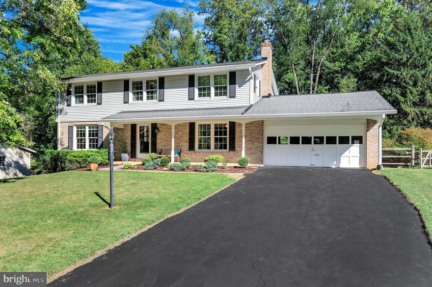 Largest colonial model in Candlewood Park with curb appeal galore. Expansive 4BR, 2.5 BA plus 2 car attached garage.  Hardwood flooring on both levels and loaded with updates throughout.  From the welcoming front porch to the refreshed interior you will love this home. Lots of fresh paint, updated hall bath-2023,  spacious eat-in kitchen includes new recessed lighting, dishwasher and disposal all in 2023,  recent a/c & furnace-2019, replacement windows 2011 and more. The lower level has a walk out slider to the rear yard and additional windows to create the perfect space, while rough in plumbing further expands your options. Enjoy the views from the rear deck amidst this lovely oasis for birds and wildlife.  Private and fully fenced rear yard  with a level lot provides lots of room to spread out and the garden space and a rear patio provide additional options. This coveted mid county location has no HOA and is close to everything.  Enjoy nearby shopping, restaurants,  Lake Needwood Park and Golf Course and other services.  It's a commuters dream with a  quick dash to Shady Grove METRO and the ICC.  Magruder school district and only two blocks to Candlewood Elementary.