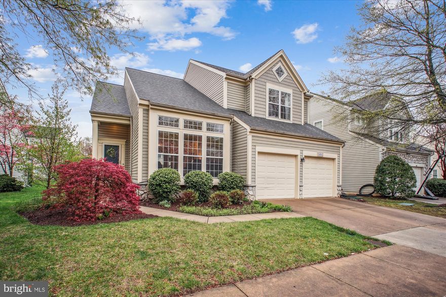 Discover 2454 Arctic Fox Way, ideally situated in The Courts of Fox Mill—just minutes from Reston Town Center, Dulles Airport, and major commuter routes. This beautifully presented 4,318 square-foot home showcases meticulous attention to detail, blending elegant finishes with modern amenities.

The current owners have invested over $100,000 in upgrades since 2017, including: **NEW induction range (2024), NEW refrigerator (2024), kitchen renovation (2017), primary bath renovation (2017), removal of a partial wall near the foyer to open the space, refinished and added hardwood floors, updates to all bathrooms, rear deck addition, professional landscaping, loft louvres, double banisters on all stairs, updated lower-level bedroom, and more (see complete list in the disclosures)!

Spanning three fully finished levels, the home features a main-level primary suite, hardwood floors, high ceilings, crown molding, oversized windows, recessed lighting, two fireplaces, multiple walk-in closets, a finished basement, and a convenient mudroom/laundry room off the two-car garage.

The eat-in gourmet kitchen includes a center island with breakfast bar, stainless steel appliances, granite countertops, crisp white cabinetry, a contemporary tile backsplash, and a breakfast area framed by sliding glass doors that open to the rear deck and paver patio. The kitchen flows into a bright, airy family room with a fireplace and picture window.

The main-level primary suite offers hardwood floors, two walk-in closets, and a spa-like ensuite bath with a soaking tub, glass-door shower, dual vanities, and modern tile finishes. Also on this level: open yet distinct living and dining areas, a powder room, and convenient mudroom/laundry room.

Upstairs, the loft level features two generously sized bedrooms, a full bath, and a spacious bonus room—ideal for a home office, studio, or additional bedroom.

The finished lower level includes a large recreation/game room, full bath, bedroom, and a utility room with ample storage.

Enjoy easy access to dining, shopping, entertainment, parks, recreation, and several nearby golf courses. Served by top-rated Fairfax County schools, this home is a fantastic opportunity to own in one of the DC area's most desirable communities.