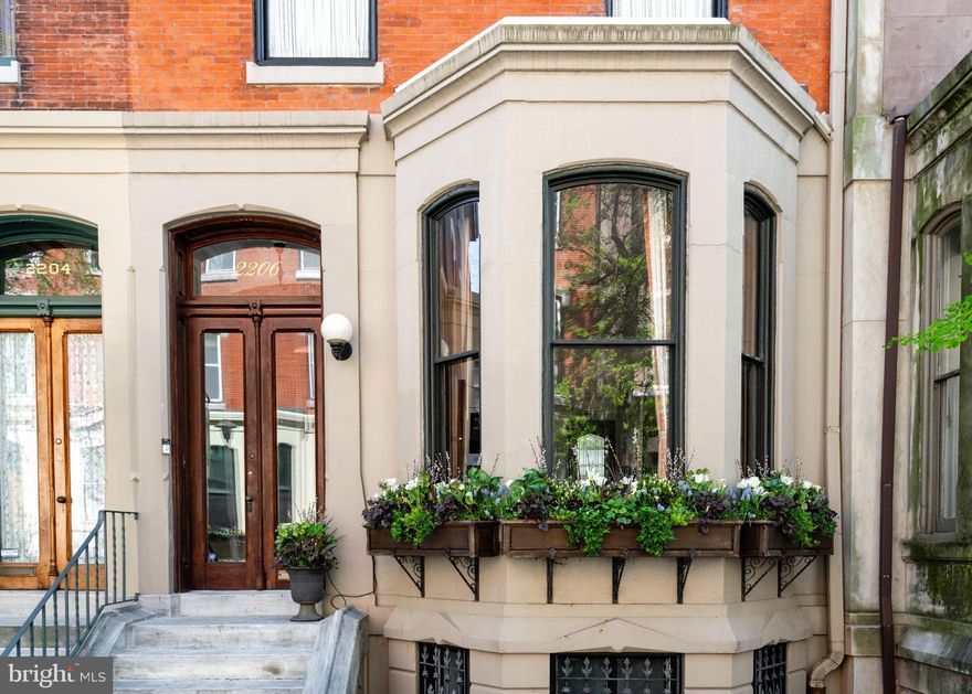 Welcome to 2206 Delancey Place - An exquisite 20 ft wide townhouse nestled on a quiet tree-lined street, steps from Fitler Square park. This meticulously crafted residence with 2 private outdoor spaces spans over 3500 SF across 4 levels allowing for spacious rooms and an ideal floor plan with 4 bedrooms + office/den, 4 full bathrooms and a powder room. 

Enter through the vestibule into the open living room with high ceilings, large windows and natural light that floods the interior, creating an inviting ambiance throughout, only enhanced by a stunning gas fireplace. The south-facing eat-in kitchen with custom cabinetry and stone counters, walks out to a lovely deck overlooking the private garden. Also on this level is a walk-in pantry and conveniently located powder room. 

The second level features an elegant primary suite, adorned with built-in wardrobes and a luxurious bathroom complete with a soaking tub, oversized shower, and double sink vanity. Adjacent to the primary suite is a handsome den, currently used as an office, graced with a stately fireplace and custom millwork, perfect for moments of relaxation or productivity. Additionally on this level is a conveniently located laundry room.

The third level offers three bedrooms and two full bathrooms, providing ample space and privacy for family and guests. A finished lower level offers endless possibilities for use as a private guest suite, home gym, playroom, media room, or studio. A full bathroom, cabinetry, and a walk-out entrance to the garden further enhance its versatility.

This prime location immerses you in the heart of the Fitler Square neighborhood, surrounded by local restaurants and shops such as Sally, Bacchus, Trattoria Carina, Good Karma, and more. Located in the Greenfield School catchment, and a short walk or bike commute to Penn, HUP, CHOP, Drexel & 30th Street Station.

Seller is offering one year prepaid parking at a neighborhood lot.