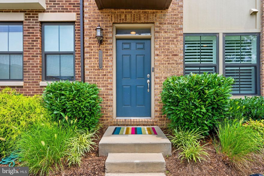 Stunning, practically new, 4 level town house in the heart of Riverdale Park Station.   Only a few hundred yards to Whole Foods, Golds Gym, Burtons Restaurant, and Denizen’s Brewery.  Just minutes to the Rhode Island Trolley trail which gives easy access to College Park heading north and Hyattsville heading south.   As you enter the home on the ground level there is a flex space that could be used as an office or rec area, even a sleeping area.  Adjacent to this room is a sizable half bath with very nice finishes.  This level also has access to the one car garage where you will find a cubby for the trash cans, a utility closet and a good-sized storage space. Up the steps to the open concept main level, you will find an abundance of natural light in the kitchen, living and dining areas, dramatic 9ft. ceilings and contemporary, high-end finishes to include stainless steel appliances, 42 in white cabinets, a large center island, quartz counters, luxury vinyl plank flooring and wainscoting in the dining area.  There is also an additional half bath on this level. The third level features two spacious bedrooms with double door closets, a full bath with double vanity, linen closet, and laundry.    The fourth level is currently being used as an office but this an additional flex space.  This could become an additional bedroom or rec area.  Off this fourth level room is an incredible roof top deck.   Mins to metro, UMD, Trader Joes, bus routes and Metro. Shows like a model home.