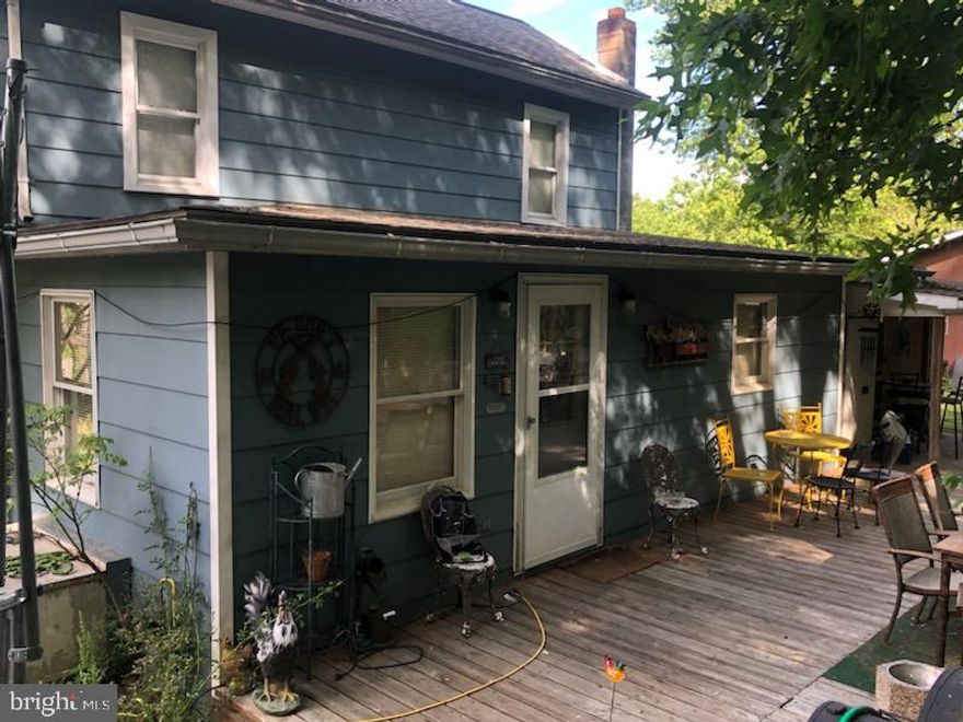 Motivated Seller.  Take a step back in time with this charming 1920  Colonial  Farmhouse located close to Berkeley Springs.  Unrestricted!!  Move-in ready. Great for full time living or weekend getaways.  House has three bedrooms, one on main level and two on second level, large country kitchen, dining room, craft room, den, and main floor laundry.  Rear patio to enjoy summer evenings, fire up your grill, or relax and enjoy the wildlife.  New hot water heater, well pump and electric recently upgraded to 200 amp service w/new panel box. You will love the oversized, detached garage, perfect for the mechanic, car enthusiast or maybe a small business.  The two pellet stoves keep the house warm and cozy while keeping your electric bill down.  You will not run out of things to do here, Cacapon River is just minutes away for floating, fishing (really big catfish) and swimming.  Easy access to hospital, grocery, restaurants, and more. Enjoy the antique shops and short trips to Cacapon Resort State Park, Morgan County Observatory,  Eisolon Nature Preserve and Potomac Valley Audubon Society, and Sleepy Creek Wildlife Management Area with 22,928 acres for nature lovers, hunters and hikers just to mention a few.   Seller advises that all vehicles and other personal property will be removed from property prior to closing.