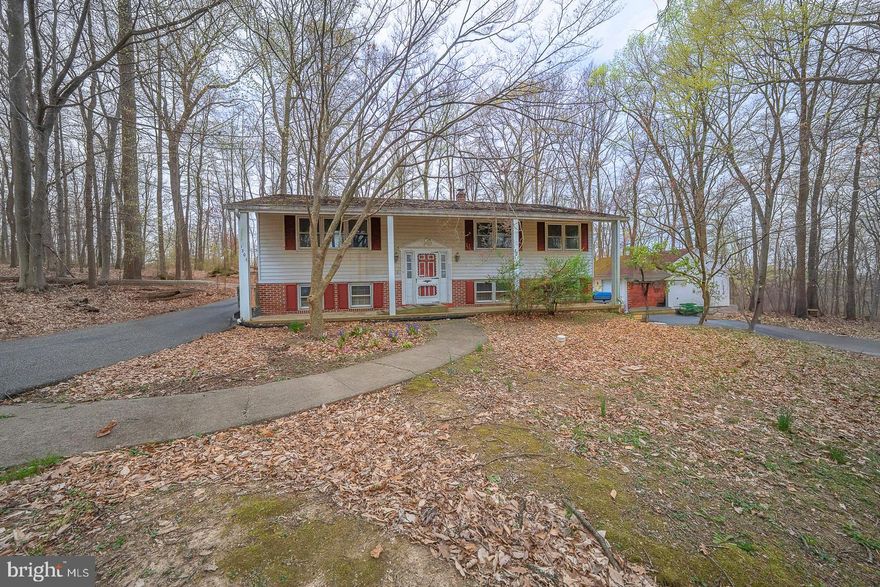 Located in the Award Wining Downingtown Schools & S.T.E.M. Academy.   Tucked down a private lane on an acre of properpty.  Three Bedroom Bi-Level with a lot of potential for the future buyer(s).  Open Living Room to Dining Room, Slider to Deck.  Eat-In Kitchen, Sink with Side sink, Electric Range, Pantry, Ceiling Fan/Light.  Pull Downstairs to partially floored attic.  Full unfinished basement with outside door to the three car detached garage.  Great garage for the car buff.    Being Sold "As-is", buyer(s) responsible for Use & Occupancy Permit from Township.  Great opportunity to live on an acre of property in Downingtown.  Conveinently located to Rt. 30 By-Pass, Minutes to Downtown Downingtown, Lionville Shopping Center, Wegmans, Septa Rail System and much more.