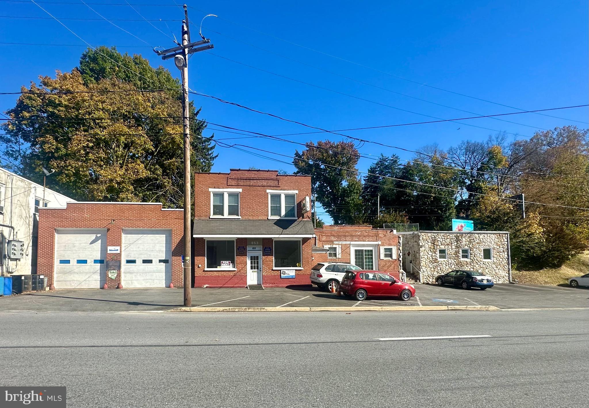 Turn Key Opportunity!!! Auto Shop and 3 apartments with 20 parking spaces in great condition. Set up your private showing today