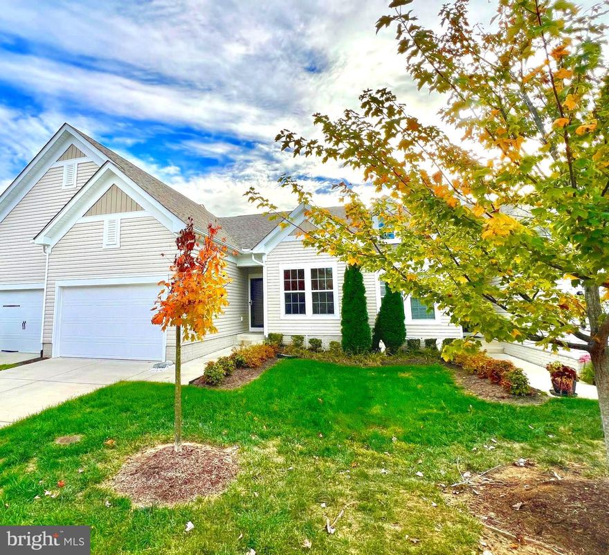 Open house Sunday, 12/7 from 12-2pm.  Price improved just in time for you to buy for the holidays!  This is the one you have been waiting for! This beautiful home is nestled in the sought after Celebrate VA North, a quiet, sidewalk and amenity filled 55+ community! You will feel right at home as you enter the bright, open concept floor plan. Perfect for entertaining and enjoying everyday living, the large kitchen overlooks the dining and living area. Experience the breathtaking views of beautiful sunsets across the home while observing life in the community as it passes by and watch Fredericksburg Nationals fireworks inside and from the deck.  High end finishes include gleaming hardwood flooring, recessed lighting, ceiling fans, new light fixtures (baths, entryway and kitchen), new faucets in baths and kitchen sinks, new carpet in the bedrooms and a spacious, maintenance free, solar lit deck added new in 2023.  Freshly painted throughout! The gourmet kitchen features a new dishwasher and refrigerator! Relax in the owner's suite with a beautiful seamless glass framed tile shower, large double vanity and lots of closet space.  With a split bedroom floor plan the secondary bedroom, full of natural light is perfect for guests, with a full bath.  The main level laundry is conveniently located outside of the primary suite and the newer washer and dryer convey with the sale!   The walkout basement offers an additional 1386 square feet of unfinished space, including full windows, a walk-out sliding glass door, and rough-in plumbing for a future bathroom.   All yard upkeep and maintenance is provided by the HOA.  Additionally, the irrigation system is serviced by the HOA in spring (March) and fall  (October) every year!   Plenty of parking with a one car garage, driveway, and lots of additional open parking spaces on the side and rear streets.  Stay active with all of the amenities Celebrate has to offer! Enjoy access to the community Lodge, swimming pool, fitness center, tennis court, pickleball, rock garden, walking trails, and so many more community fun activities!  Located a short drive from I-95, shopping centers, restaurants, Urgent care and medical lab services, specialty medical and dental care services all within minutes and a nearby hospital.  Schedule your showing and make your offer before this home is sold!