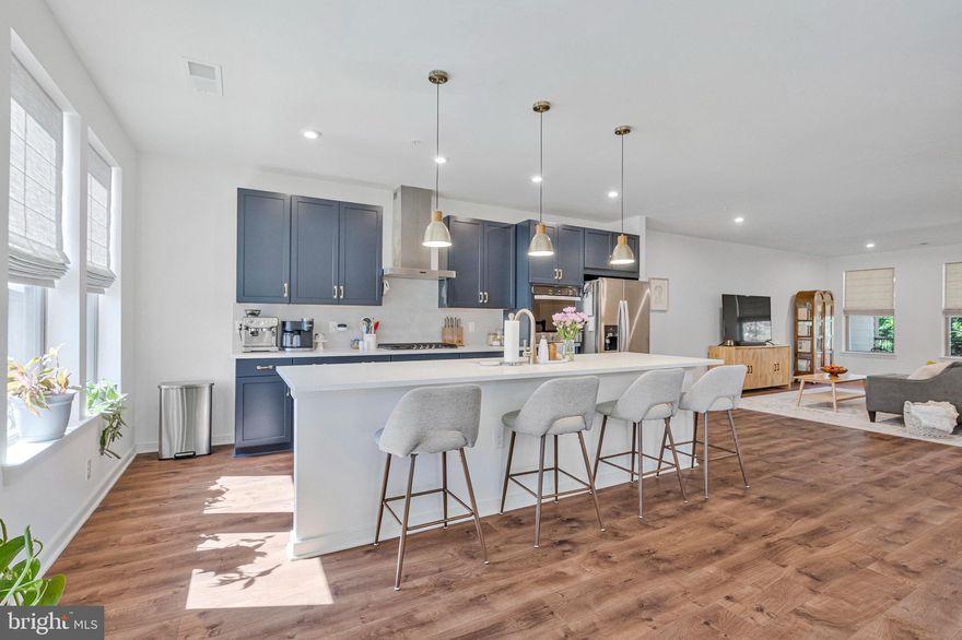 Regal Chase townhome condo built in 2024, just minutes away from Dulles Airport, Dulles Town Center. and One Loudoun. This townhome offers an unparalleled lifestyle with its prime location adjacent to vibrant shops and enticing restaurants.

Step into the state-of-the-art kitchen with double ovens, where culinary dreams come to life. The kitchen features a huge island with seating for four, adorned with striking navy blue cabinetry and elegant gold hardware, pendant lights, and faucet. The open-concept design flows seamlessly into the dining area and living room, perfect for entertaining guests or enjoying intimate family dinners.

On the main floor, you'll find a convenient office and a stylish powder room. Step outside to your serene, private covered balcony with ceiling fan, offering picturesque views of lush trees and breathtaking sunsets—your own personal oasis for relaxation.

The magnificent primary suite is a luxurious retreat, boasting a double vanity bath, a spacious shower with a dressing area, and a massive closet. Upstairs, enjoy the conveniently located washer and dryer. The second and third bedrooms are bright and sunny, sharing a hall bath with double vanities, ensuring comfort and convenience for family or guests.

Throughout the home, sleek, modern black hardware, light fixtures, dimmers and ceiling fans add a touch of modern elegance. Additional features include high ceilings, an enclosed main door entryway for added privacy and security, a mudroom including a closet, spacious garage and driveway parking. Community amenities include a sport court, dog park, fitness area, recreational area (playground), tot lot and picnic area with barbecue grills.

This townhome condo in Regal Chase combines luxury, convenience, and style, making it the perfect place to call home. Just a few of the nearby restaurants include Taco Chinoz,  Sushi Mori, Mission BBQ,  Sweetwater Tavern, Ivy by the Lake, Local Provisions, The Don’s Wood Fired Pizza,  First Watch, Burton's Grill & Bar & Urbano Modern Italian. Experience the best of both worlds with suburban tranquility and urban excitement at your doorstep.