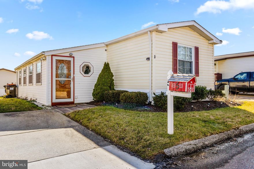 Back on the market, buyers not approved.  Welcome to 5 Mango Trail located in Biscayne Bay Mobile Home Community.  This 2 bedroom, 2 bathroom single wide is well maintained and tastefully updated.   This home feature a sunroom addition with access to deck with retractable awning.  Updated bathrooms and flooring with recently replaced roof this home is truly move in ready.  Located in a great location close to parks, marinas and restaurants come enjoying this quaint community.  Off-street parking included.