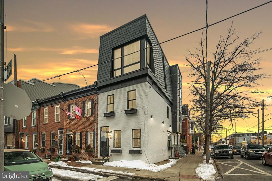 Welcome to 2150 Kater Street! This stunning, custom built home, is on the corner of a charming tree-lined street in the heart of Graduate Hospital, Greenfield Catchment, close to South Street, parks, shopping, dining, and much more! This home has a gracious open floor plan encompassing 2,200 square feet of living space with 4 bedrooms and 3 full baths. The crisp white and black paint on the  brick exterior and slate single siding boasts a modern entrance and embodies the true beauty and character of the Graduate Hospital area. The interior welcomes you with stunning wide plank White Oak hardwood flooring, an open floating staircase with white oak treads, a modern open floor plan with abundance of natural light flowing throughout. The main living area inside features a wide living space with dining room, and to the rear of the home you will find the modern chefs kitchen; complete with Calacatta quartz countertops, custom maple network grey cabinetry, GE Cafe Series stainless steel appliances with a 6 burner gas stove, subway tile backsplash, woodworking accents, shiplap hood and a breakfast bar with barstool seating.  Make your way to the second floor where you will find 2 sizable bedrooms featuring tons of natural light with custom closets, a laundry room, and one full hall bathroom that features geometric tiling, floating vanity, and modern finishes. Moving up to the third floor you will find the private primary bedroom suite complete with a large walkthrough closet, stunning feature accent wall, white shiplap ceiling and tons of natural light. The luxurious primary bathroom features a custom floating vanity with quartz counters, walk-in shower with double rainfall shower-heads , body wands and a skylight. The roofdeck is a must see and truly embodies Center City living. Move down to the finished basement, where you will find plenty of space for a fourth bedroom, fully equipped with a full bathroom and closet space for additional storage. To complete this home, there is a smart doorbell and thermostat and an approved 10 Year Tax Abatement from the City of Philadelphia. Seller is also providing 1 year, pre-paid parking with an agreed upon offer! Schedule your showing now, there is no home like this on the market!