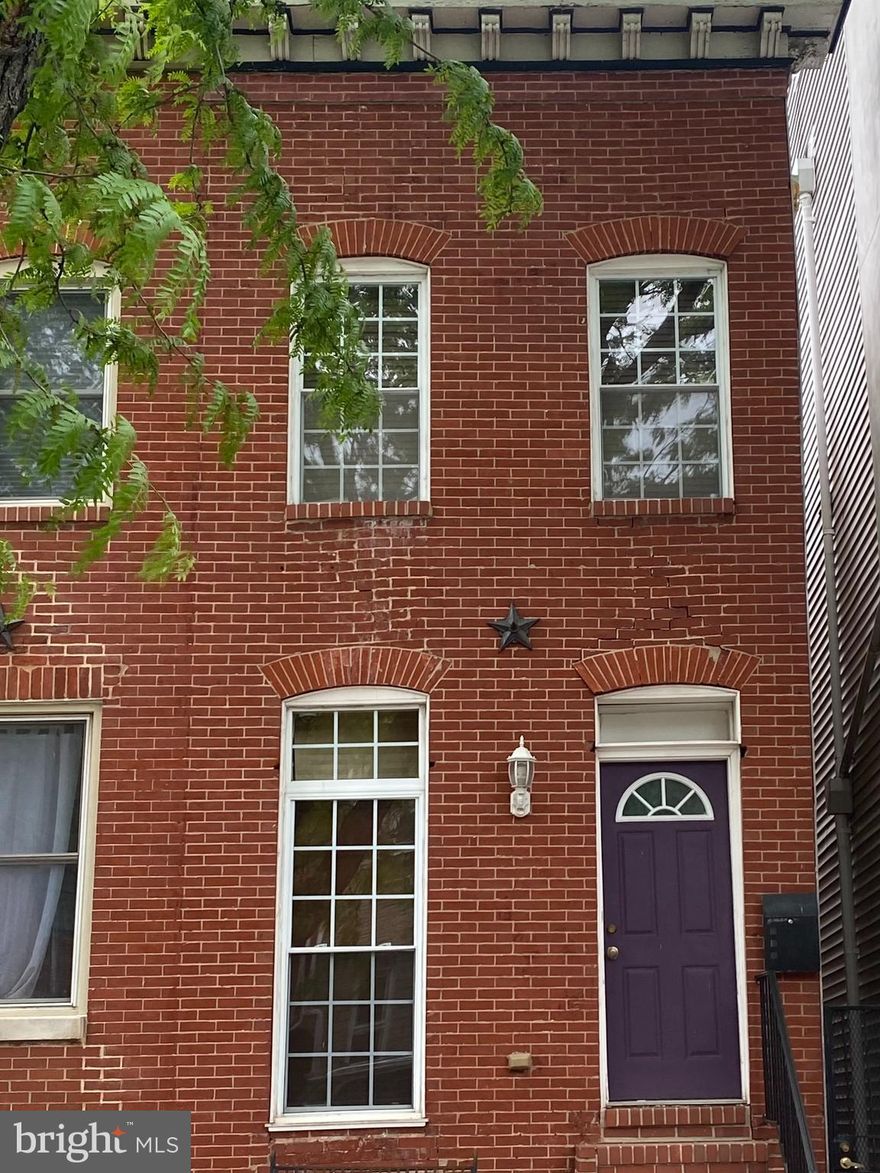 Brand new beautiful CHAP renovation row house in Upper Fells Point is less  than 2 months from being completed. The 1st floor is open with lots of natural light, exposed brick, tall ceilings, gourmet kitchen with a professional stove, large breakfast bar, wet bar with beverage fridge, half bath and mud room. There is a large stone patio off the kitchen, which is perfect for entertaining. The property behind was converted into a large garage 27 by 15 with  additional garage door to be able to pull one car through making parking for two spots.  The basement was dug out to 8 feet and features additional family room, full bath and bedroom.  The upstairs has 2 bedrooms and baths, the primary is in the rear and has a barn door leading into the primary bath with a soaking tub, large shower and double vanity. The ceiling are vaulted with exposed beams and brick. There are to many extra finishes to mention, you'll just have to see it.