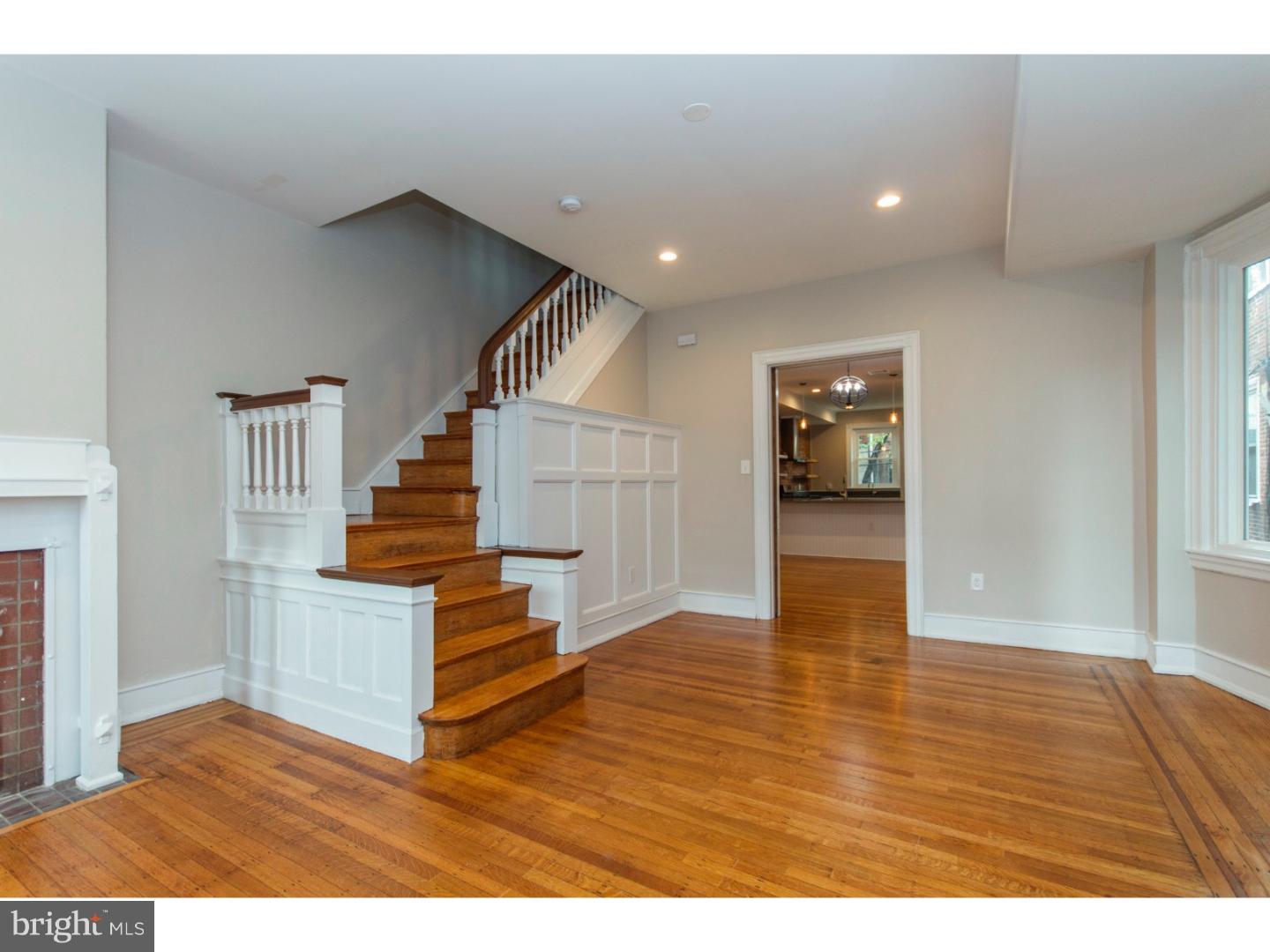 Lots of original details preserved, including: stained glass windows, original trim and doors, original floors. Large master suite with fireplace, three closets and en-suite bathroom. Two bedrooms and second full hall bath. Finished basement with third bath. Huge kitchen with exposed brick wall, open shelving, tons of cabinets, and stainless samsung appliances.