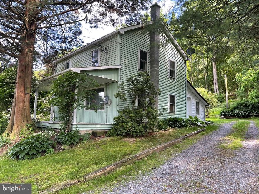 Rural with valley views. 2 Story home with hot water oil heat, season log structure, metal roof, 2 out buildings included, open and wooded. Sited on 1.5 acres. Call listing agent for personal tour.