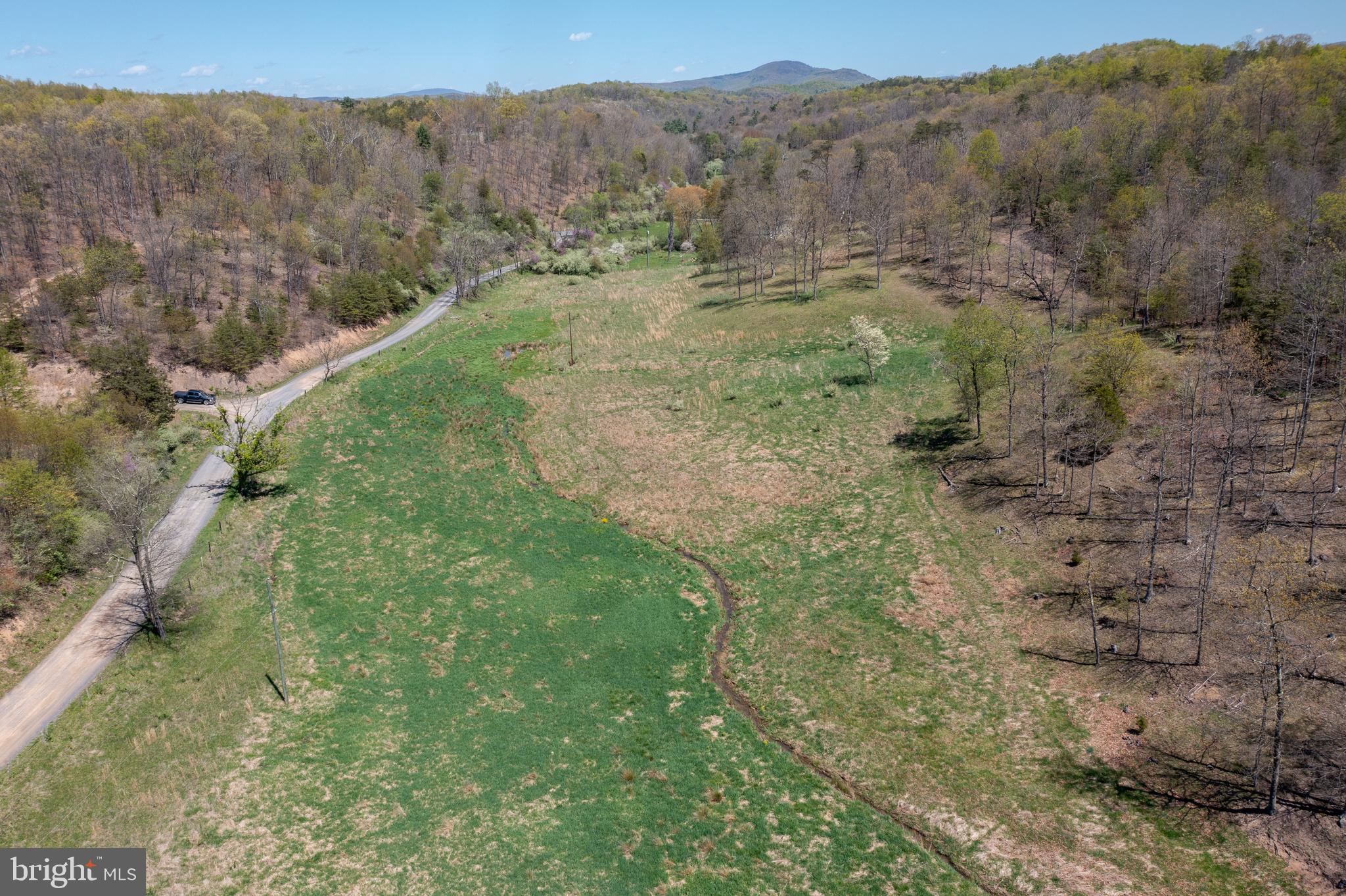 Dreams do come true! Acres and acres of beautiful, rolling, rural land! Partially wooded and partially cleared with a beautiful stream running through the property. Come build your dream home or your weekend getaway in Wild and Wonderful West Virginia! Plenty of acreage for hunting and riding ATVs. Located just minutes from public river access to the South Branch of the Potomac River! This beautiful property is approximately only 25 miles from Cumberland, MD and 47 miles to Winchester, VA! Don't wait! Come take a look before it's gone!