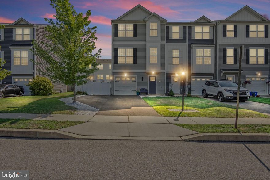 Built in 2017, this 3-bedroom, 2.5-bath townhome offers 1,619 square feet of comfortable living space and thoughtful design. The main living areas flow seamlessly, while the bedrooms and laundry on the upper level provide convenience for everyday living. The kitchen features stainless steel appliances and granite countertops, perfect for cooking and entertaining.

Enjoy outdoor living on the spacious balcony and patio, complemented by a fully fenced yard, ideal for pets or gatherings. Additional parking is easy with the extended driveway that fits two cars, a rare feature in this community.

This end-unit home combines modern style with practical upgrades, offering a bright, open, and inviting space in a sought-after location.