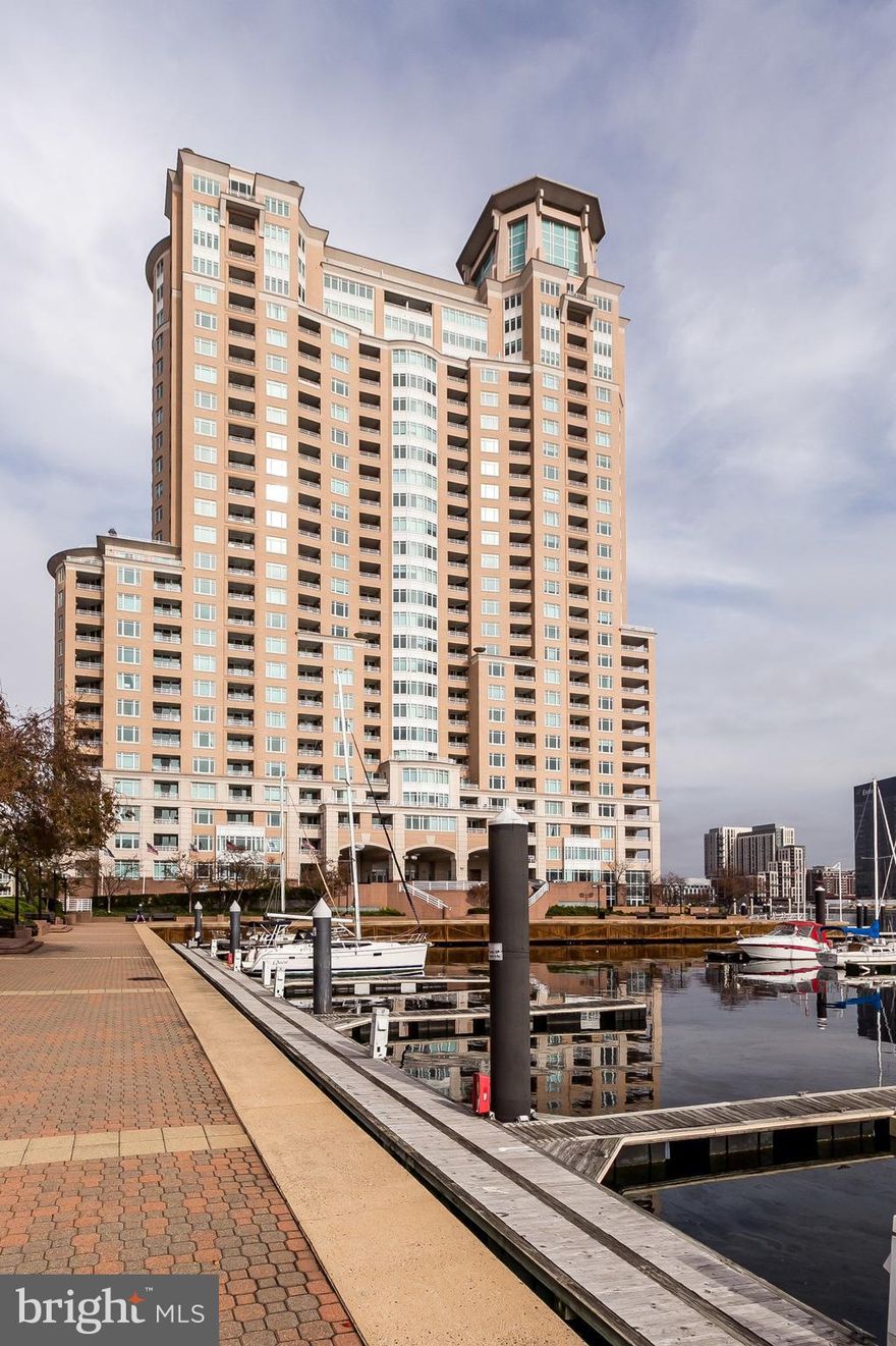 Luxury Waterfront Living at HarborView Marina & Yacht Club!  Stunning 1BR | 1.5BA Condo ready for immediate occupancy!  Wake up to panoramic water views of the Harborview Marina, Fort McHenry, and the iconic Domino Sugar sign from your private bay window!!  This bright, sunlit 1,117 sq ft condo has a beautifully designed open floorplan! Interior highlights include large open living/dining area, spacious eat-in kitchen featuring new luxury vinyl flooring, lots of cabinetry, storage space, pantry, and center balcony for outdoor dining! Spacious main suite with picture window, custom outfitted walk-in closet, and private balcony entrance.  Primary bath offers Jacuzzi tub & tile finishes.  Convenient foyer powder room, washer/dryer in unit. This condo offers lots of natural light year-round!  Included with sale:  1 assigned gated garage parking space. HarborView Marina & Yacht Club community offers world-class Resort-Style Amenities, 24/7 concierge, on-site security staff, Indoor & outdoor pools, steam room, sauna, extensive state-of-the-art fitness center, Billiards, social lounge, business center, conference rooms, banquet space and on-site Guest suites available for you, your friends and family! On-site gourmet deli with patio dining, beautifully landscaped grounds with walking/jogging paths, seasonal gardens, park benches & water fountains.  Prime South Baltimore Location steps to nightlife, gourmet restaurants, shopping, stadiums, and the free Charm City Circulator! Easy access to I-95, MARC train, and just 9 miles to BWI Airport! This is high-rise resort living at its finest—schedule your private tour today!   HarborView Marina & Yacht Club – Where luxury meets your exciting Harbor lifestyle!
