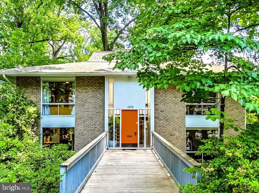 Don't let the street fool you - come see the coolest house and most livable retreat in Silver Spring! Make sure to explore the neighborhood through the back. Verdant oasis meets urban convenience in this mid-century home designed by architect Neil R. Greene in delightful and sought-after Woodside Park. Three full floors of resplendent light and floor to ceiling windows bring the natural beauty of the outdoors in, creating unexpected privacy and tranquility. The open flow throughout the home seamlessly ties the entire place together while still maintaining separate, defined work and play spaces. Sliding glass doors run along the back of the home on all floors: on the main level, glide them open to the full-length deck for a utopian entertaining experience; on the bedroom level, enjoy a balcony feel from the primary bedroom ; finally, note how the above grade lower level has views every bit as serene as the rest. Behind the home is a private drive with plenty of space for parking or enjoying like your own private cul-de-sac. It's so quiet that you may almost forget you're a quick hop over from Zinnia and surrounded by all the amenities of Silver Spring! **Make sure to see the virtual tour/property website with floor plan, additional information, and 3D walkthrough tour.