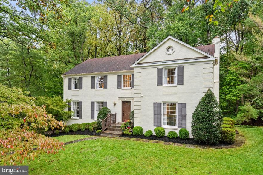 Gracious Center Hall Colonial Updated throughout and located in highly coveted McAuley Park! Gleaming Hardwood Floors, Eat-In Kitchen with Granite and Stainless, Two Woodburning Fireplaces, plus Main Level Office (check out the cool, retro wetbar!) Formal Living and Dining Rooms plus side entry into MudRoom/ Laundry.   Upper Level with Hardwoods, Oversized Bedrooms which feature highend  Built-Ins and Updated Baths. Primary with Vanity Area, Walk In Closets and ample storage.  Finished, Walk-Out Lower Level with Woodburning Fireplace, Half Bath, and Storage.  Attached Two Car Garage.  Refurbished Deck perfect for entertaining overlooks yard with Swing Set (conveys) and Cabin John Park.  In the sough-after Churchill School Cluster, this stellar location offers stately homes with mature trees in close-in commuting location, NO HOA!