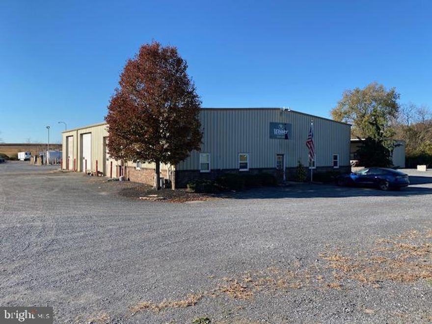 7200 Sq. Ft. building including office areas and large shop with 5 overhead doors. The office areas include a foyer area with bath, and 3 additional offices and an additional bath. Offices are heated and cooled with a mini-split system. The shop area consists of a large open space with 5 large overhead doors, compressed air lines, loft area, and locker room. In addition to the main building is an overhead storage building, and 2 large fuel tanks. Roughly 3 acres of stoned parking space also included.