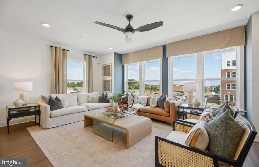 Available for a June of 2025 Closing.  $20,000 in Closing Costs tied with the use of Pulte Mortgage Corporation.  This 4 level Halston Way townhome offers spectacular views from an outdoor Rooftop Terrace!  It includes 4 bedrooms, 4.5 bathrooms.  The first floor offers a 2-car rear entry garage with an EV rough-in plug.  The first floor also offers a full bathroom with a tile shower and bench seat as well as a frameless glass enclosure.  The versatile flex room with French doors that can be used as a home office or exercise room or hobby room.  Upstairs, on the main level, a rear kitchen opens to a sizable cafe and gathering room with a Scion 55' electric fireplace with a beautiful 12" x 24" tile surround.  The gourmet kitchen offers upgraded Kitchen Aid stainless steel appliances, Soft-close Greyhound kitchen cabinets with Calacatta Laza Quartz countertops and 1" x 4" Herringbone - Nautical Gray backsplash. A powder room, coat closet, and step-in pantry are located on this level.  Enjoy the outdoors with an included 8' x 18' Deck located off the kitchen!  For the chef that loves to grill, a gas line stub out has been installed.  On the 3rd floor, you’ll find 3 bedrooms along with a convenient laundry room. The owner’s suite has a large walk-in closet and the owner’s bath has 12" x 24" Calacatta Empire floor and wall tiles and a frameless shower door. The 4th Floor includes an great sized loft, a beverage center and an additional bedroom and a full bath with a tiled, walk-in shower and bench seat and a frameless glass enclosure.   Off the loft is a Rooftop Terrace with an outdoor gas fireplace for you to enjoy. This home has upgraded wiring package, Oak stairs and 7" LVP are throughout this gorgeous townhome.  This home has a Rinnai tankless water heater located in the mechanical room off the garage.