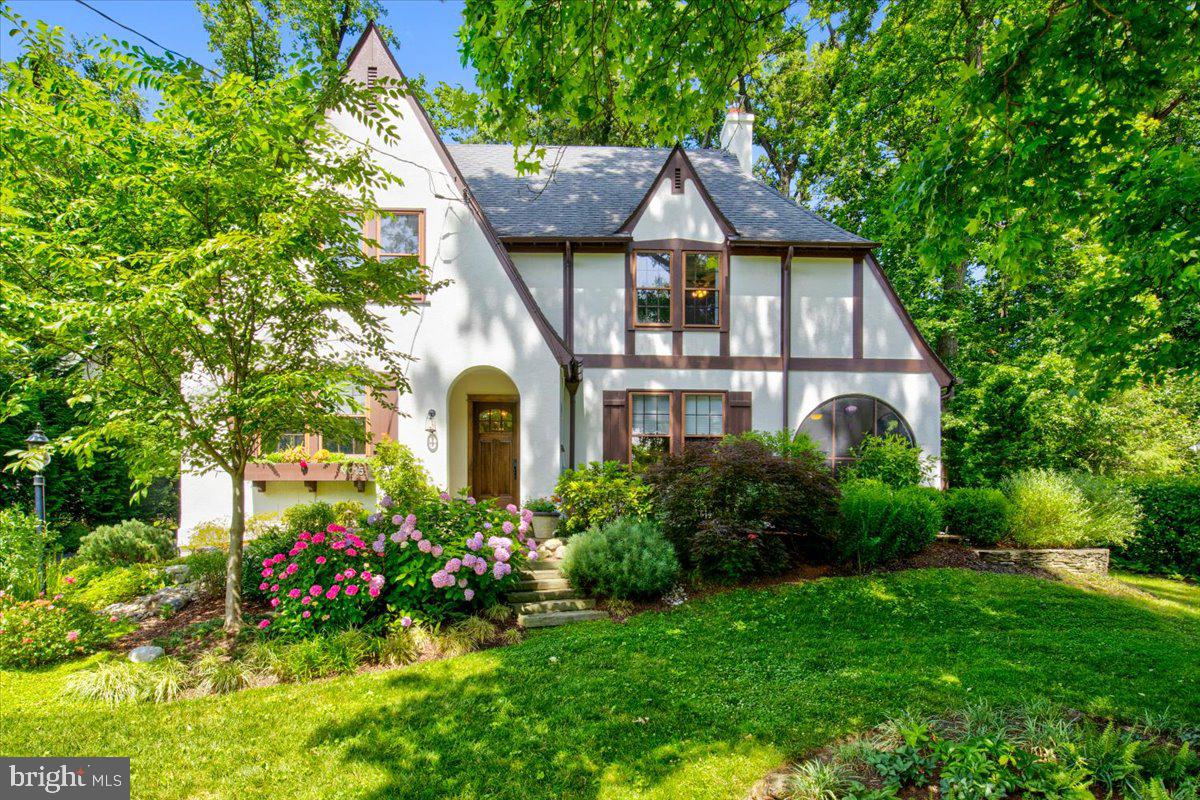 Welcome to this lovingly maintained Chevy Chase Tudor, circa 1928 set on a lush 8,156 square foot lot with 4,055 square feet of living space.
The first floor is ideal for large scale entertaining or casual family living and features a large living room with fireplace and opening to a wonderful screened porch, gracious dining room, powder room, butler’s pantry, and a well-designed table space kitchen with a breakfast bar, and stainless steel appliances opening to a family room with access to the rear patio, and mudroom/ laundry with side access to the detached garage. The second floor has a spacious owner suite that includes a full bath and two expansive walk in closets, a second bedroom with ensuite bath, a hall bath, a two additional large bedrooms. The third level offers flexibility as a fifth bedroom with an ensuite bath or use as an office or a guest suite. The lower level houses the utility room with abundant storage space.
Located in the coveted Town of Chevy Chase blocks away from all that Downtown Bethesda has to offer, hop on the nearby Metro, or bike on the Capital Crescent trail!