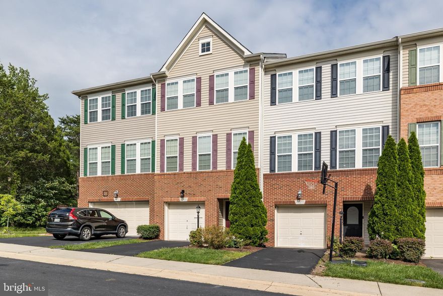 Beautiful townhome located on great lot at end of street!  Great space throughout!  Brand new carpet on main and bedroom levels! Rec room with gas fireplace with built-in shelving.  Rear of home includes deck and fenced yard.  Upper level welcomes you with large living room with hardwood floors.  Large kitchen w/stainless steel appliances, granite counters, prep island and dining space!  Access to upper level deck off kitchen; convenient for cook-outs.  Primary suite includes new carpet, walk-in closet; luxury bath w/dual sinks.  Secondary bedrooms w/ceiling fans and new carpet.  Full bath in hall.  Enjoy all of the Brambleton amenities!